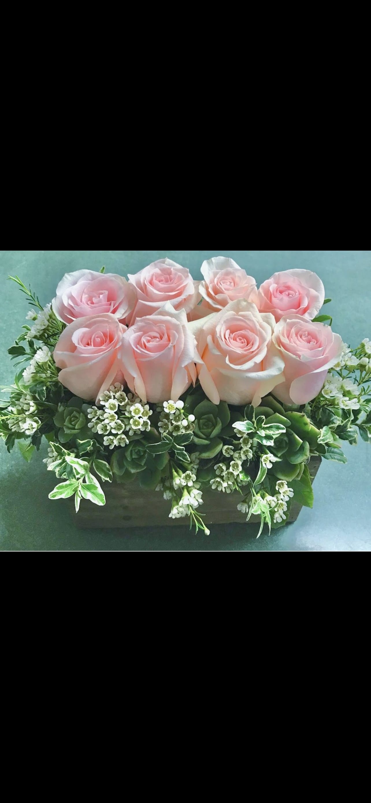 Pink Rose box - 8 roses in a wooden box filled with succulents and wax flowers. 