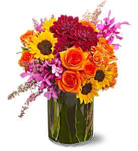 Summer Salsa - For a bouquet that’s blazing hot and spicy with color, choose this mix of coral roses, purple dahlias, pink  orchids and yellow sunflowers. It's an exciting summer salsa of flowers!