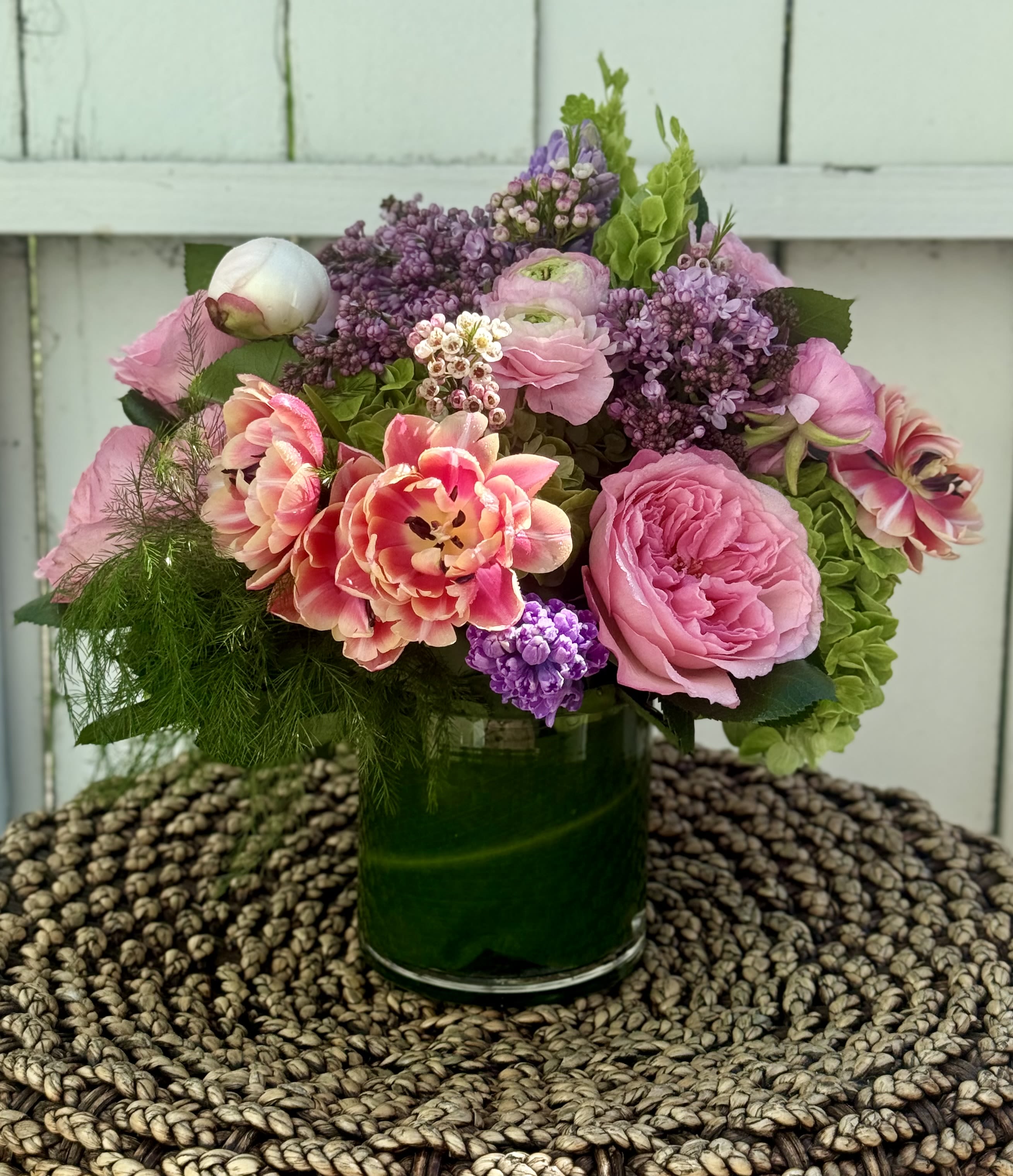 SPRINGTIME - Spring is the most beautiful time of year for gorgeous flowers! This irresistible arrangement full of lilacs, tulips, roses, ranunculous and hydrangeas is a cheerful, fun way to invite the new season into your home!