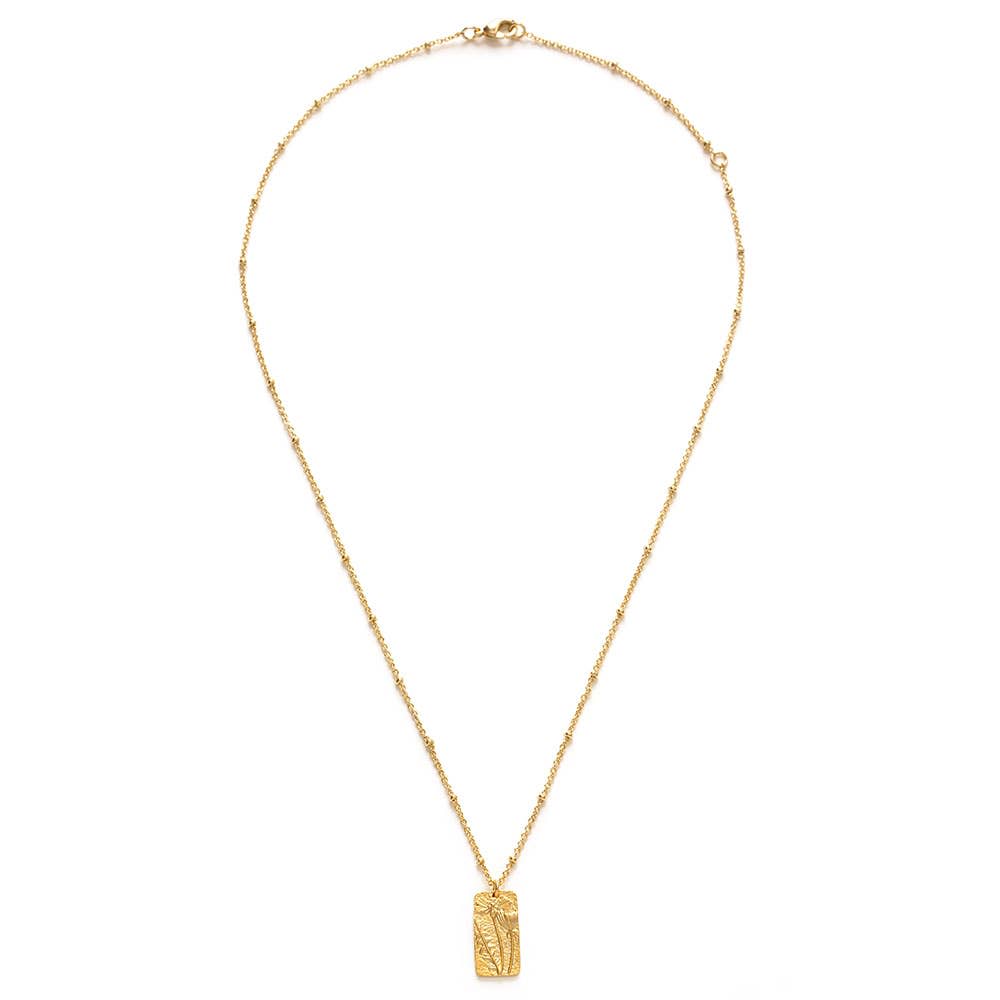 Flower Medallion Necklace - This beautiful flower medallion layers beautifully or is a sweet, simple statement all its own. The .75" medallion hangs from 18" beaded chain that is made of 14k gold plated brass that is also coated to resist tarnish and create a hypoallergenic surface.