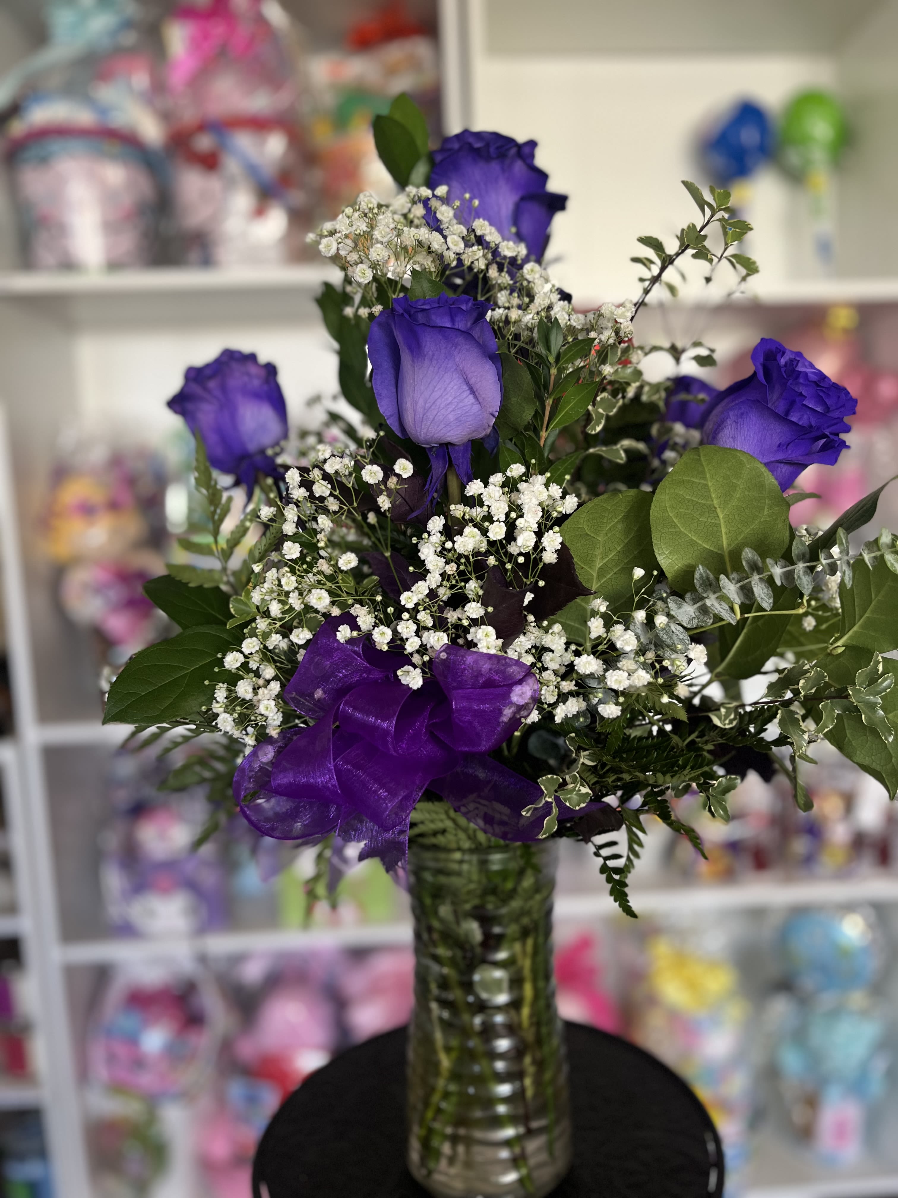 Purple Rose Bush  - six purple roses in greener y 