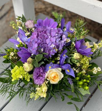 Think Spring! - Cheerful purple, lavender &amp; soft yellow spring flowers in low glass cube.