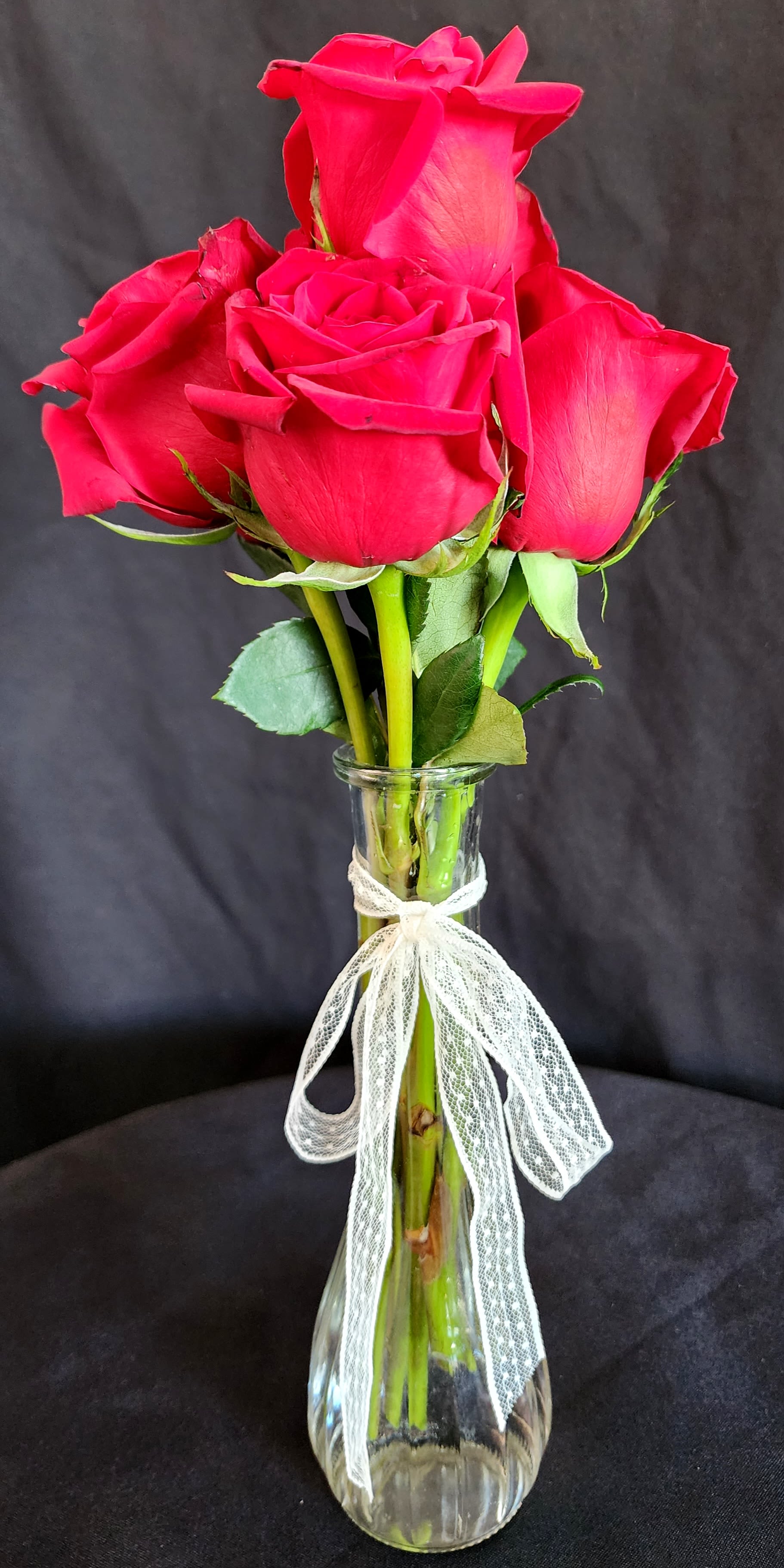 Small Red Roses by the Dozen (no greens) - These arrangements come with roses only, no greens.