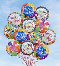 Balloon Bouquet - Happy Birthday - A burst of color and celebration, this balloon bouquet is the perfect birthday arrangement to make the person you're thinking of feel seen and cheered. The clustered bouquet of round foil balloons reads "Happy Birthday" in bold letters across mixed-color designs-bright blues, sunny yellows, and vivid reds-so it instantly signals a festive mood for birthdays, milestone parties, or any cheerful gathering.  Each balloon features playful patterns-stars, confetti, stripes, and tiny balloon motifs-tied together into a dense, floating cluster with red curling ribbons that add lively movement and shine. The assorted round foil balloons stay buoyant longer than latex and create a full, eye-catching centerpiece without needing extra fillers; ribbons are included for easy anchoring or hand delivery.  Ideal for surprising a friend, family member, coworker, or party honoree who loves bold color and energy, this bouquet is the kind of gift that makes a room feel instantly celebratory. Balloons arrive ready to display; for best results keep them indoors away from sharp objects and extreme heat to maintain their float and finish.