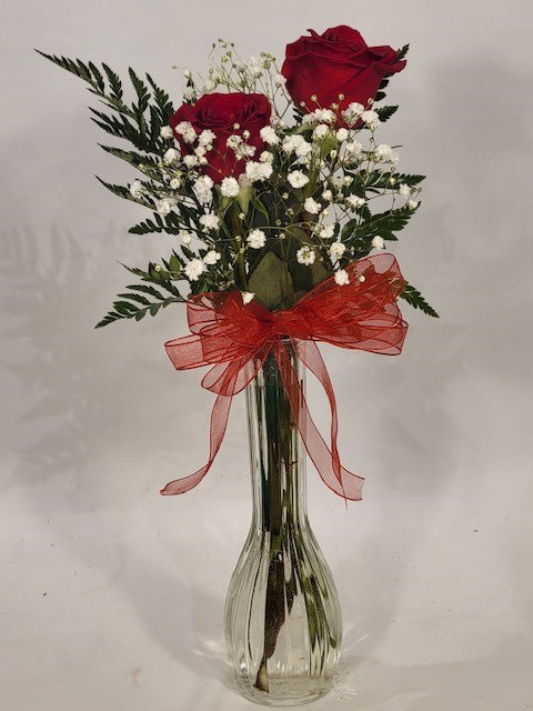 Two Red Roses in Bud Vase  -  A pair of red roses signifies mutual love and affection. 