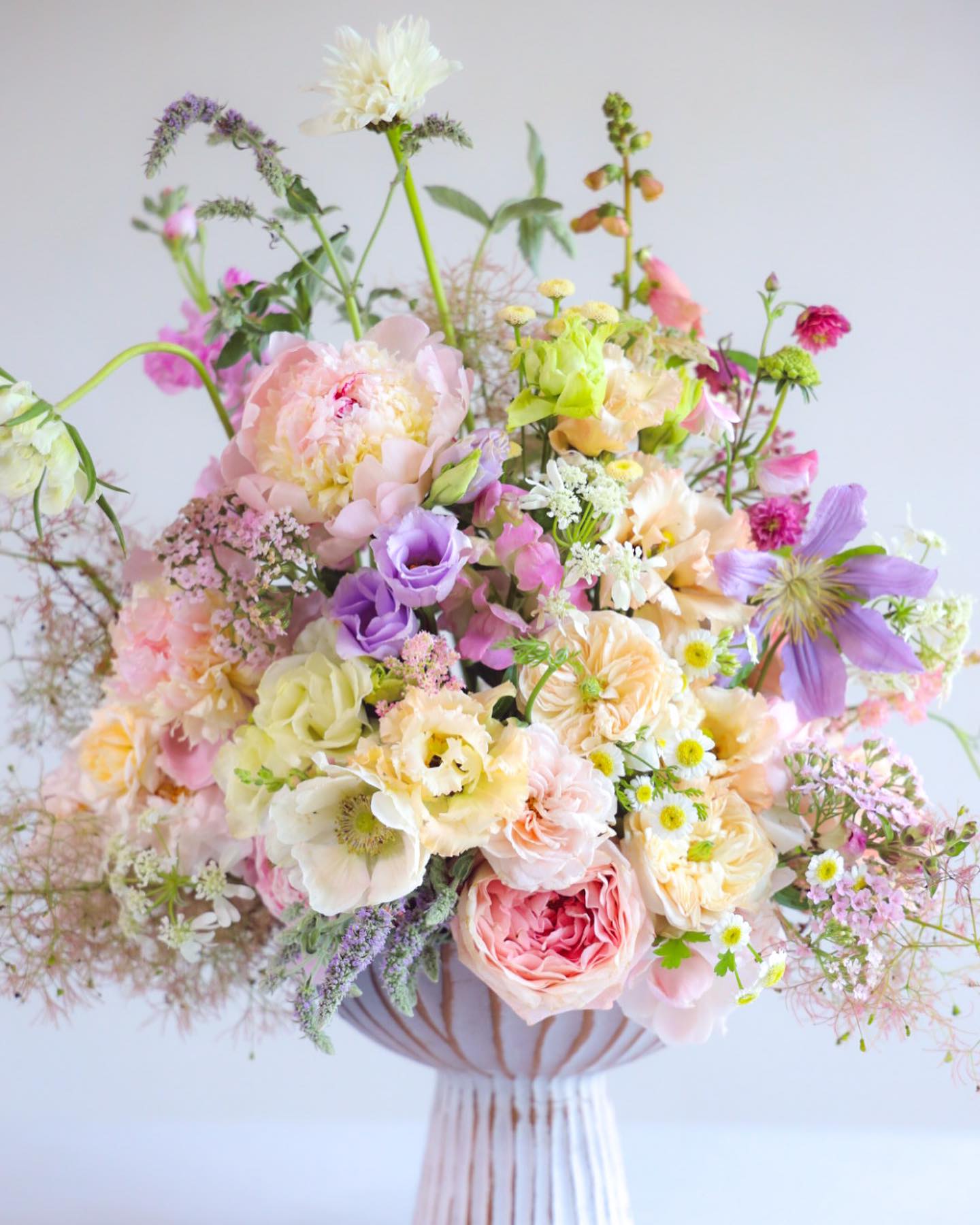 The Lace Cloud Arrangement - Shop our full collection on our fine art floral studio, direct website: www.leafsongfamilyfarm.com or call us at 207-342-2613.    Float on eiderdown, delicate lace &amp; sugared blossoms. The Lace Cloud Arrangement both comforts and soothes, spoken with artisan refinement . Speaking to those that prefer pastels, this arrangement is pure elegance.  Custom, one of a kind floral arrangements by floral artist Stacy Leafsong.  Photos provide examples, and each arrangement &amp; vase is unique.  Arrangements will be delivered before 7pm, for specific delivery time please include in special instructions. On holidays, our busiest times, deliveries will be made by 7:30pm.