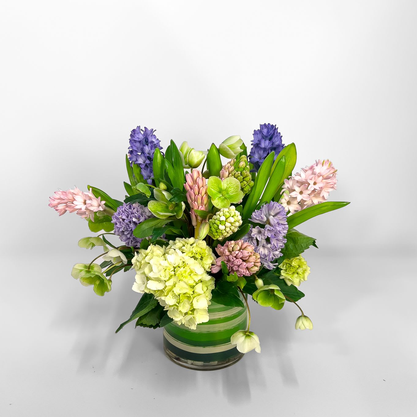 Raindrops - This mixed hyacinth arrangement is a fragrant and vibrant celebration of spring. Perfect for brightening up your home or as a thoughtful gift, this sweet arrangement brings a touch of elegance and natural beauty to any space.