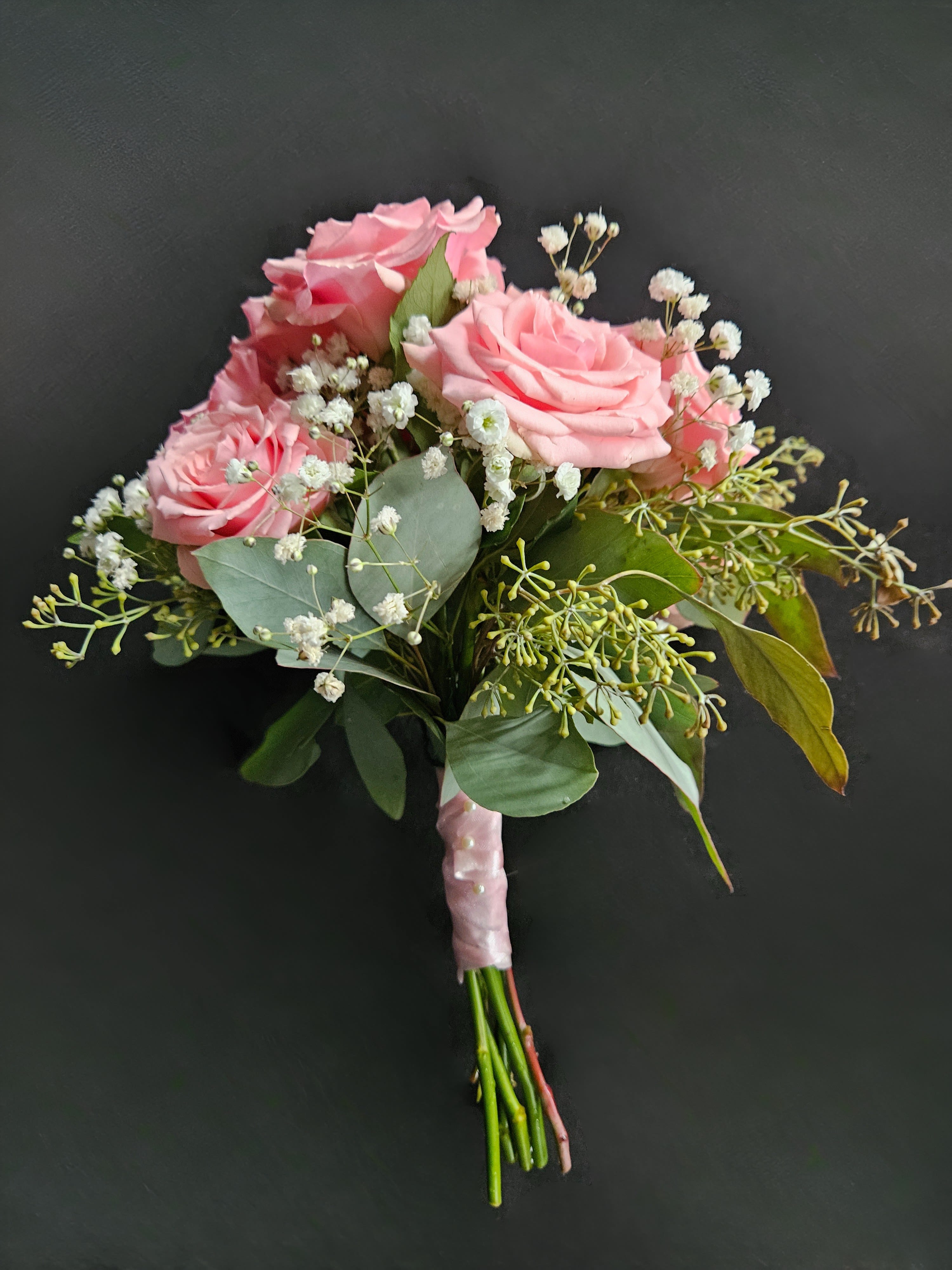 Northmont Prom Handheld Bouquet - A classic 5 stem spray rose bouquet hand-tied with satin ribbon that compliments any outfit. A beautiful addition to any prom or homecoming event. Available Colors: White, Red, Light Pink, and Hot Pink. 