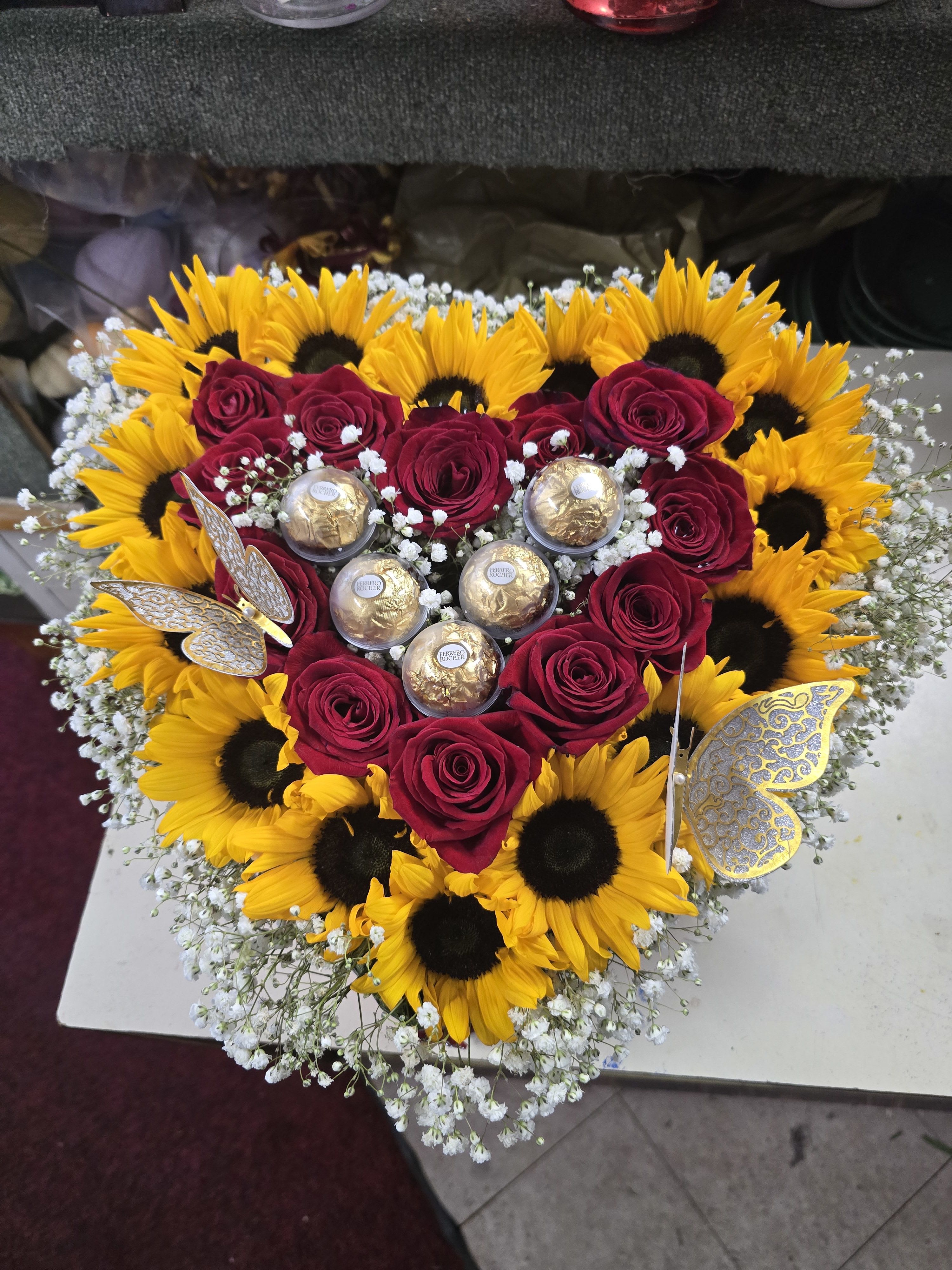  sun flowers with red roses  chocolate heart box -  NOTE: ( pictured item is a premium version which is SOLD OUT. We Have a deluxe &amp; standard version only. The roses are nestled into our traditional "Love" Box which is shape like a heart. Coming with Ferrero Rocher chocolates. 