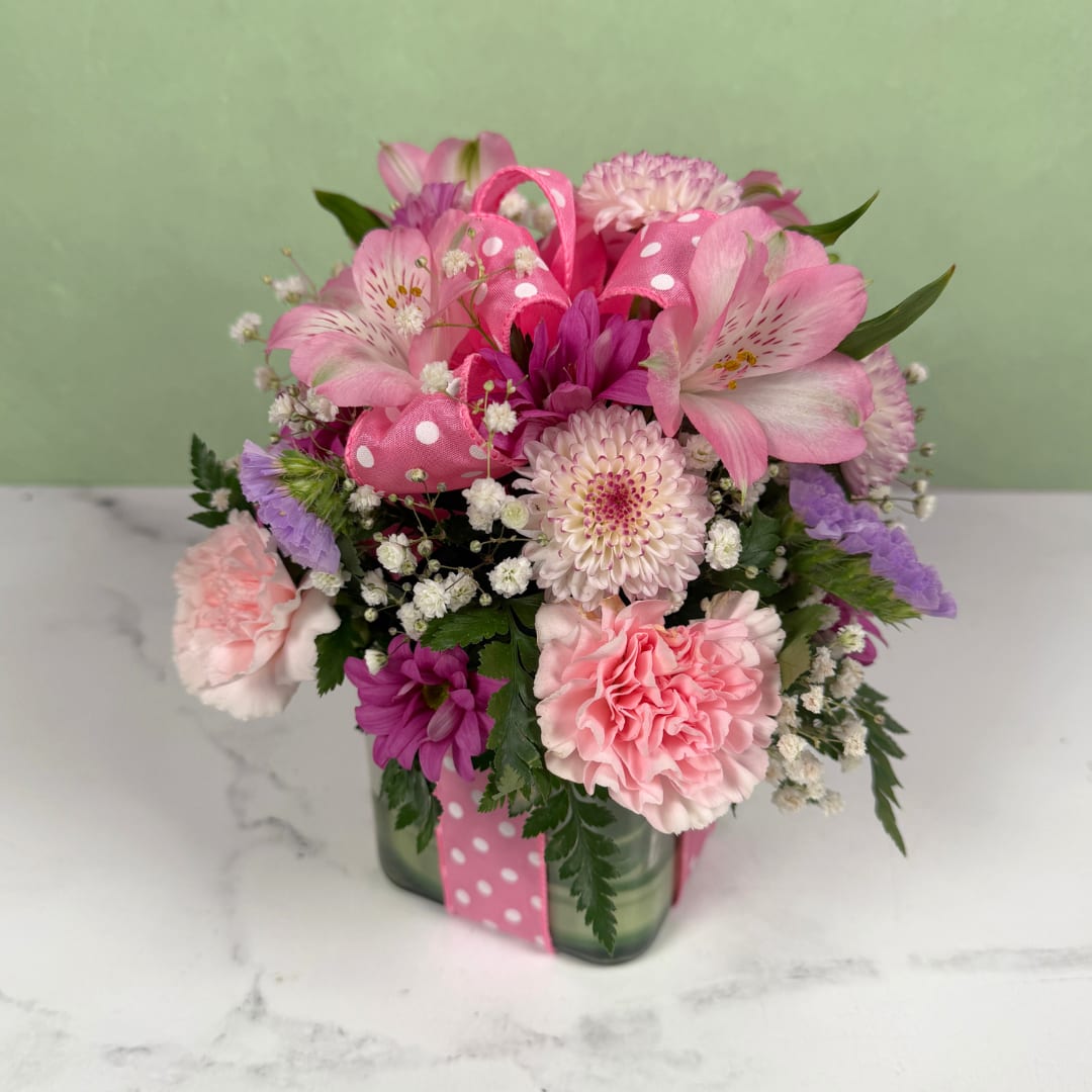 Polka Dot Blooms Bouquet - Light Pink - Polka Dot Blooms Bouquet - Light Pink,  featuring a 4" glass cubed container filled with beauty and all accented with babies breath and a fun pink and white polka dot ribbon and bow.  
