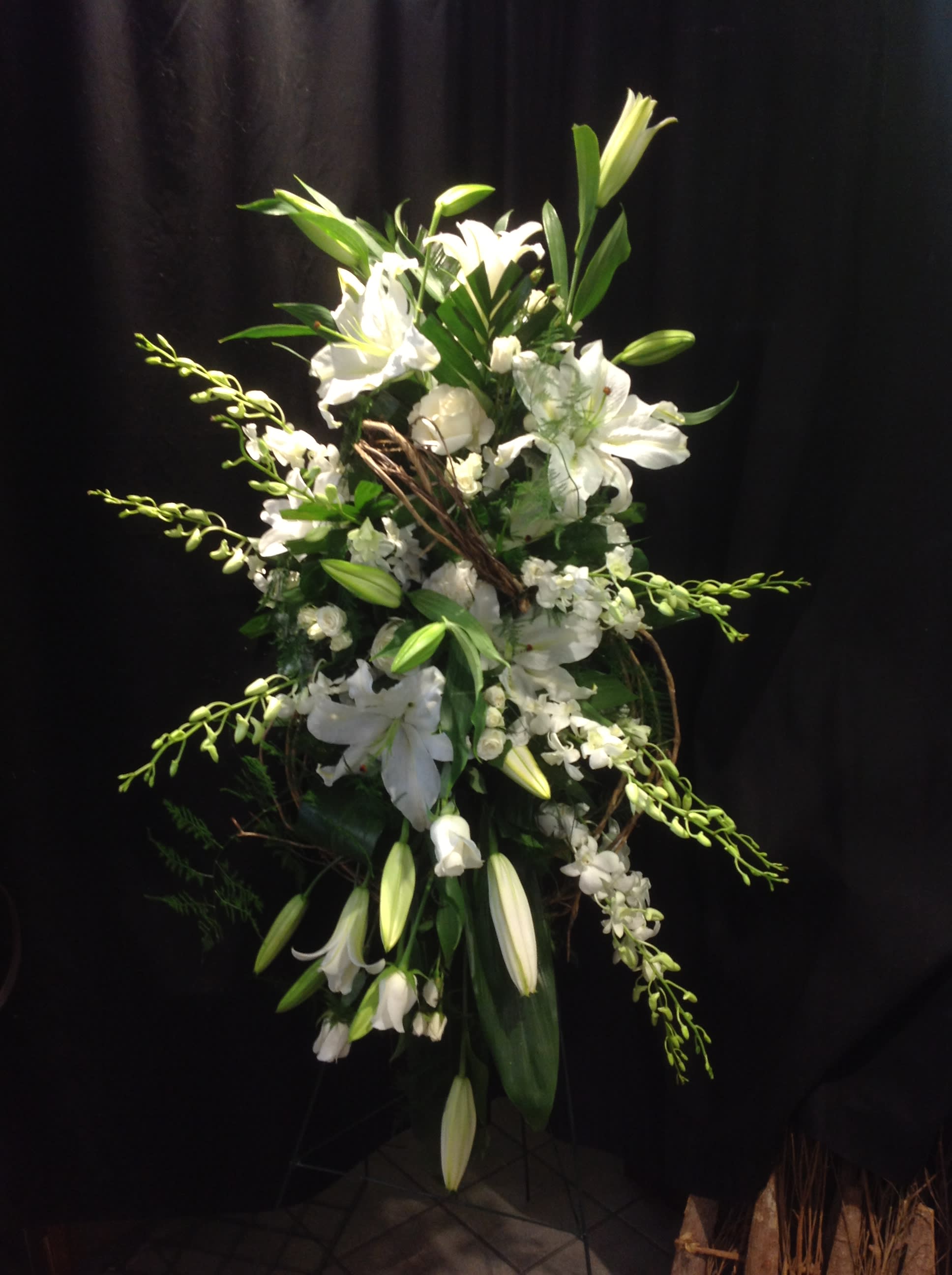 Kindness - White and green standing spray, adding that extra touch with curly willow   *Flowers subject to change based on supply*