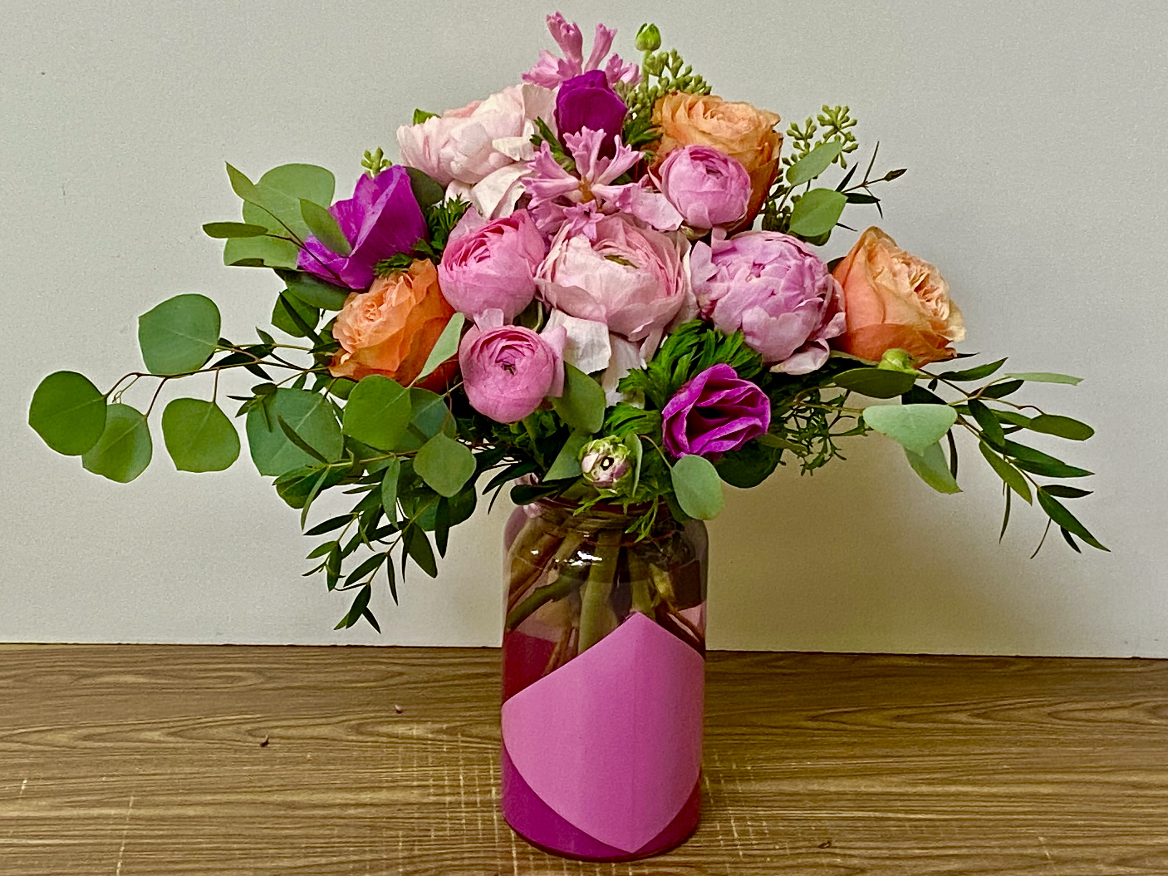MARIA - In a beautiful pink glass vase combinations of ranunculus, roses, peony, anemone