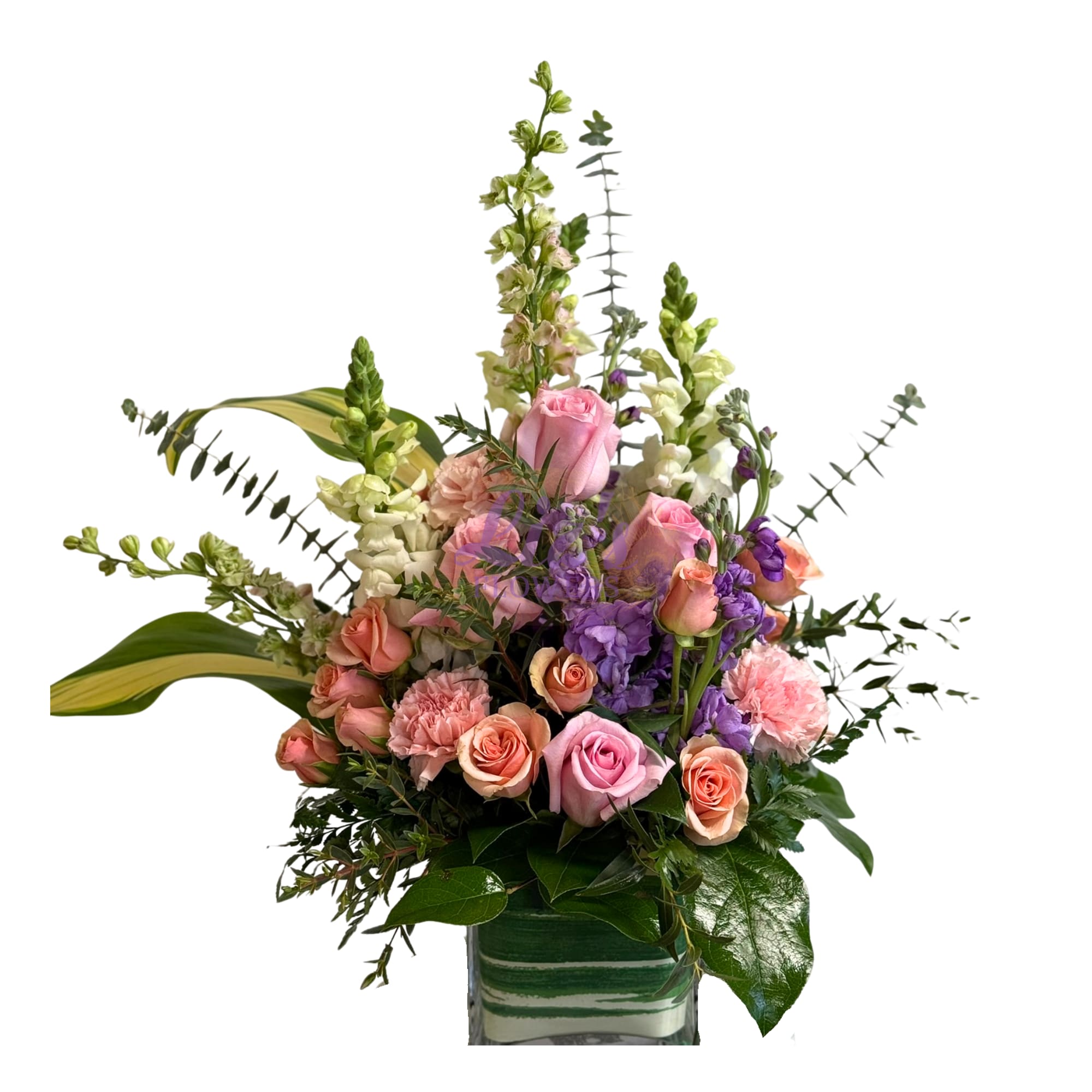 Pastel Garden Delight - A fresh mix of pink and purple blooms arranged in a square vase.