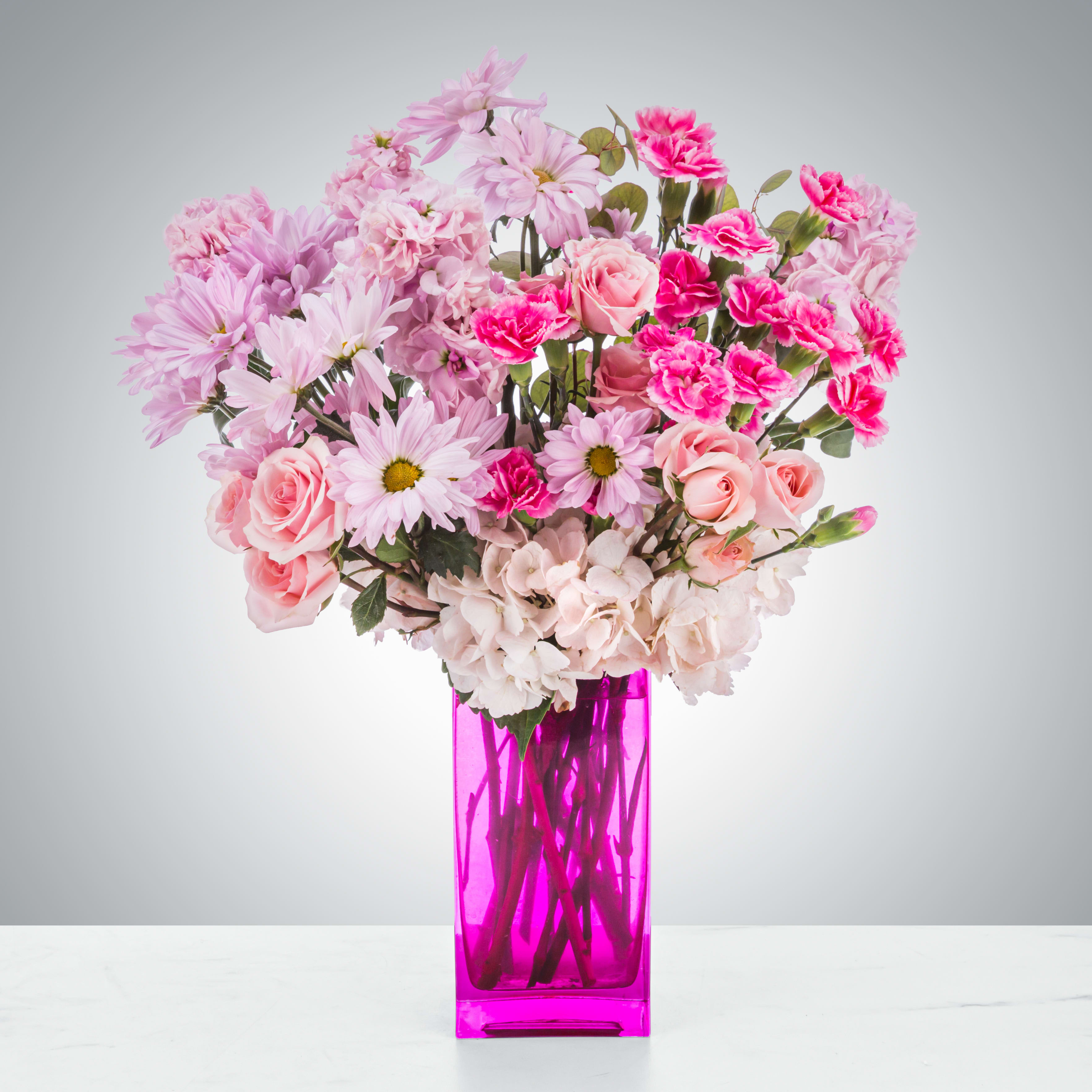 Always My Princess  - Whoever said orange is the new pink was seriously disturbed - Elle Woods. This arrangement is perfect for anybody who loves the color pink and wants something that pops! A great gift for wishing somebody a happy birthday in their favorite color or celebrating a new baby.   Approximate Dimensions: 12"D x 18"H