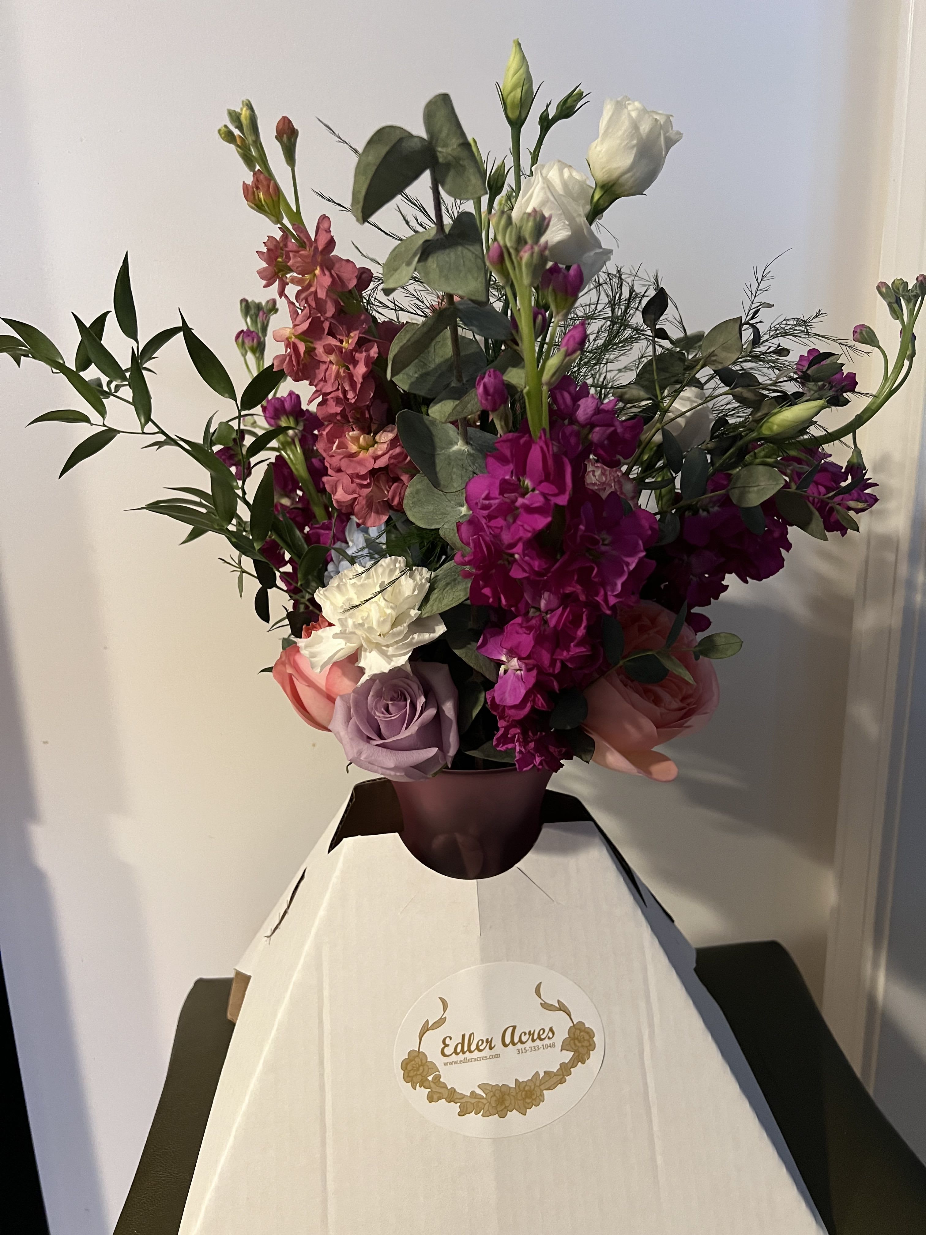  Designers choice of a Jeweled Tone  Arrangement   - A beautiful arrangement of our Jewel toned flowers.  We will use a blend of our vibrant flowers to design you a beautiful arrangement.   