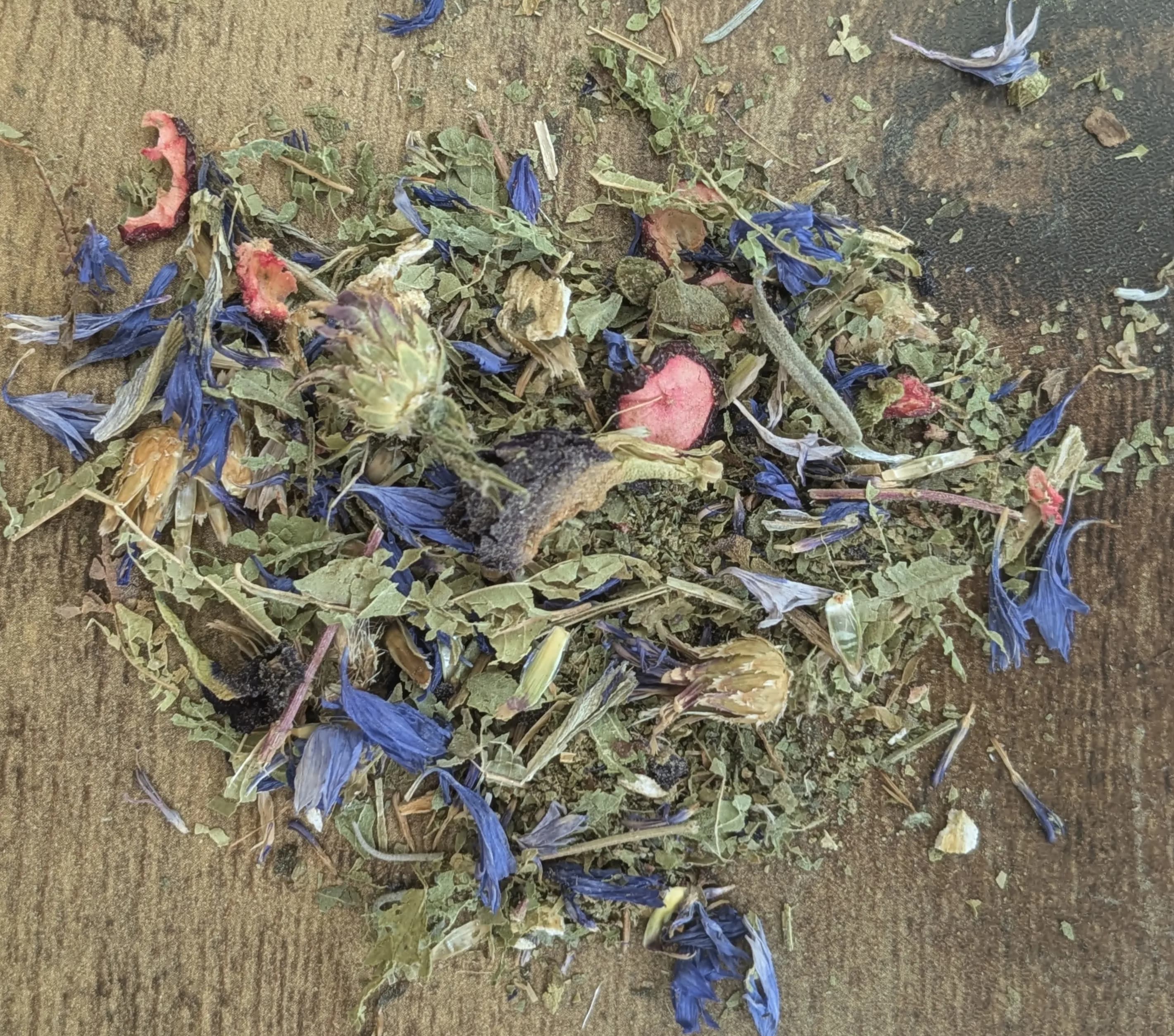 "Early Summer" Color Changing Tea - Taste the Magic of Summer in Every Sip  Embrace the vibrant hues and sweet flavors of early summer with our enchanting Color-Changing Tea. This delightful blend combines the soothing essence of lemon verbena, agrimony, cranberry, fennel, butterfly pea flowers, cornflower, lavender, and ginger for a truly unique experience.  Benefits:  Sweet and Refreshing: Indulge in the naturally sweet notes of cranberry and lemon verbena, perfectly balanced with the subtle spiciness of ginger. Medicinal Properties: Harness the power of nature with agrimony for digestive support, fennel for its anti-inflammatory properties, and lavender for relaxation. Color-Changing Wonder: Watch in amazement as your tea transforms from a mesmerizing blue to a vibrant purple when you add a squeeze of lemon. This is due to the natural pH-sensitive properties of the butterfly pea flower. Ingredients:  Lemon Verbena: Uplifting and calming with a citrusy aroma. Agrimony: Aids digestion and soothes inflammation. Cranberry: Tart and tangy with antioxidants. Fennel: Sweet and licorice-like with digestive benefits. Butterfly Pea Flowers: Natural blue pigment that changes color with acidity. Cornflower: Adds a subtle floral note and visual appeal. Lavender: Aromatic and relaxing. Ginger: Warming and invigorating with anti-inflammatory properties. Experience the Magic:  Brew a cup of Early Summer Color-Changing Tea and transport yourself to a field of wildflowers. Savor the sweetness, feel the calming effects, and marvel at the color-changing magic. It's the perfect way to celebrate the season and nourish your body and soul.  Order your bag of Early Summer Color-Changing Tea today and let the magic unfold!  Standard Prices are for 2 oz of tea.  Deluxe is for 1lb of tea.