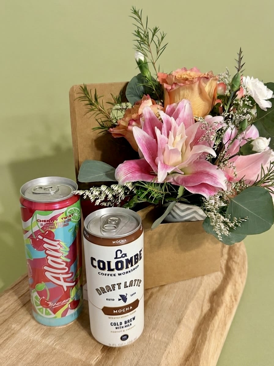 The Ultimate Pick-Me-Up carrier - Brighten a day (or yours) with our all-in-one gift bundle. Each sturdy carrier features a hand-crafted designer floral arrangement with slots to add up to three premium items—the perfect way to say thank you or treat yourself. Perfect for our lovely school teachers!   Standard carrier comes with your choice of Alani Nu energy drink (Orange Kiss, Cherry Twist, or Pink Slush) or Colombe Cold Brew (Caramel, Mocha, or Vanilla)  PLEASE LET ME KNOW WHICH TWO YOU'D LIKE TO INCLUDE. If you do not want any energy drinks, please let me know in the special instructions section at checkout and I'll simply include bottles of water instead.  Add on one of our Premium candles and we'll include it in the carrier!