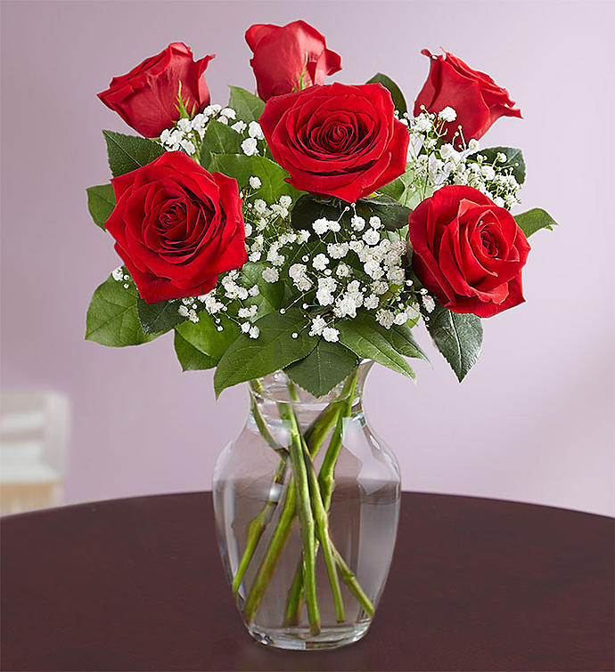 6 Red roses in a vase - Send someone a passionate embrace with our classic gift of red roses. Beautifully arranged by our skilled florists with lush greenery inside an elegant glass vase, six radiant blooms are delivered right to the door to delight them for a birthday, anniversary or an everyday romantic surprise.