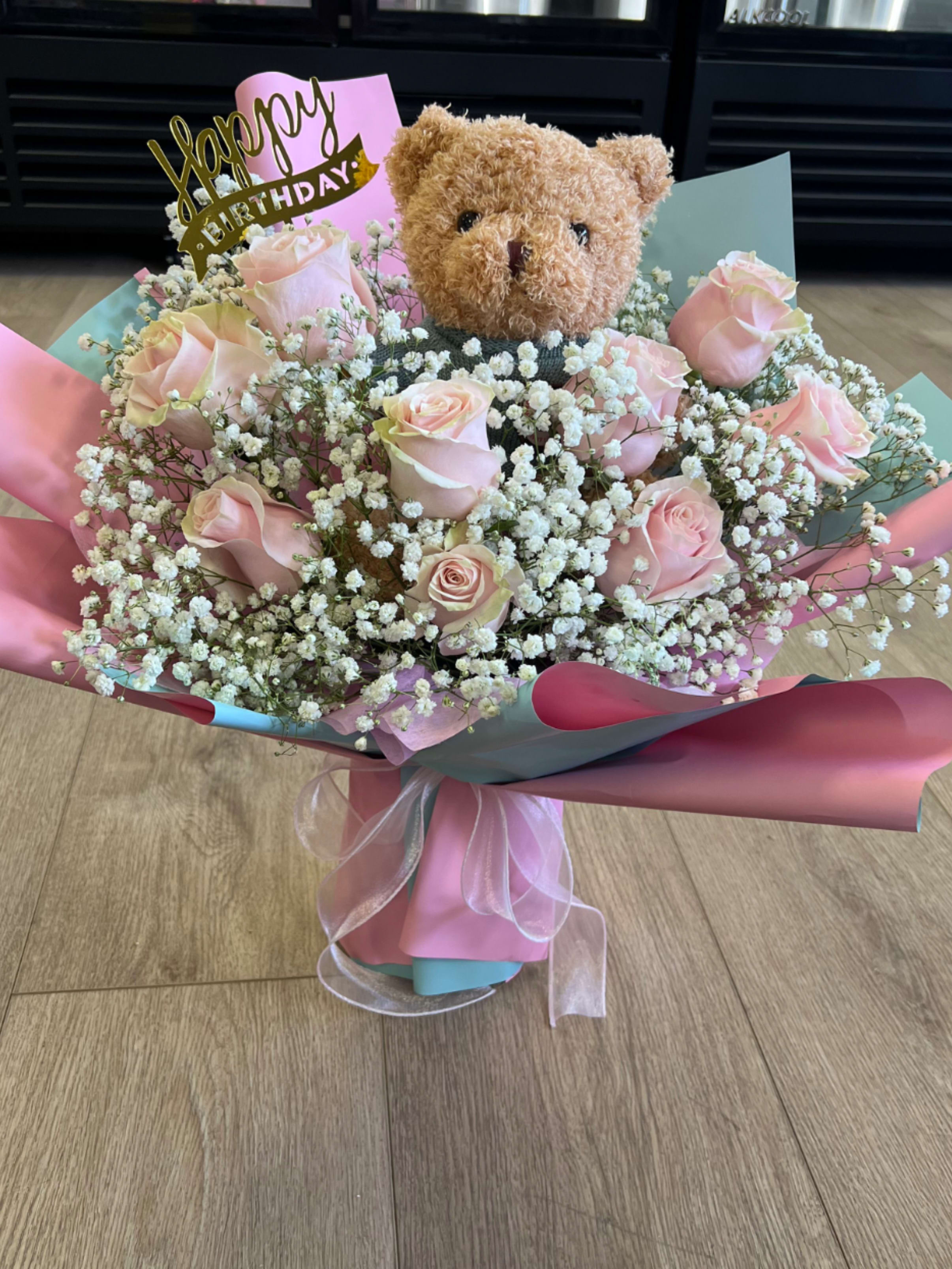 Happy birthday my bear  - Celebrate their special day with the sweetest birthday surprise   This charming bouquet of soft pink roses is a beautiful symbol of love, joy, and warm wishes. Nestled among the fresh blooms is an adorable teddy bear, adding a playful and heartfelt touch that will make anyone smile. Wrapped in elegant layers and designed with delicate fillers , this arrangement feels both romantic and cheerful — perfect for making birthday memories extra special.  Cute, thoughtful, and full of happiness — the perfect way to say Happy Birthday! 