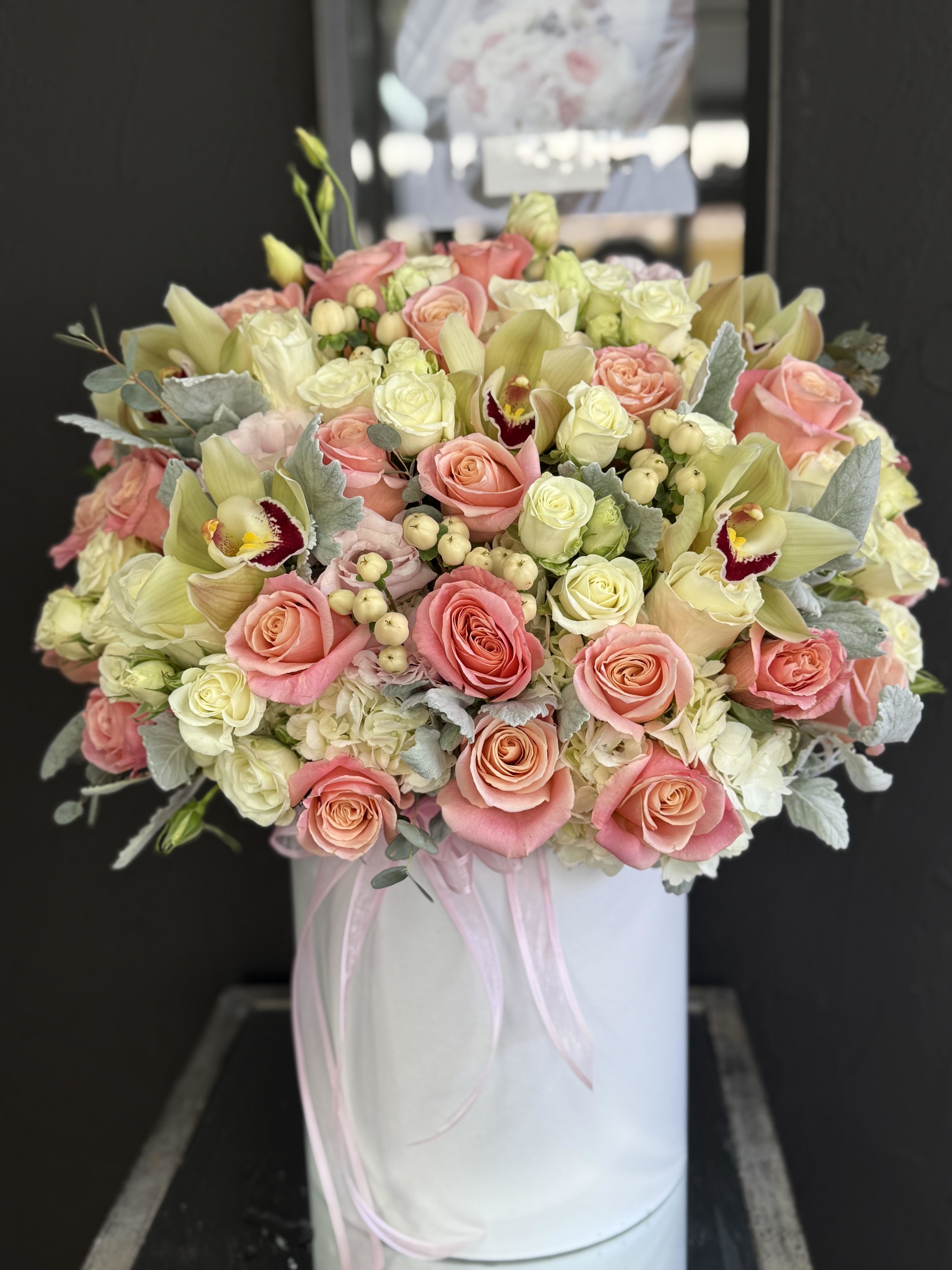 Love - A bright and cheerful arrangement of pink and multicolored blooms, inspired by the beauty of summer. Full of life and vibrant energy, this bouquet brings warmth, joy, and a playful touch of color to any moment.
