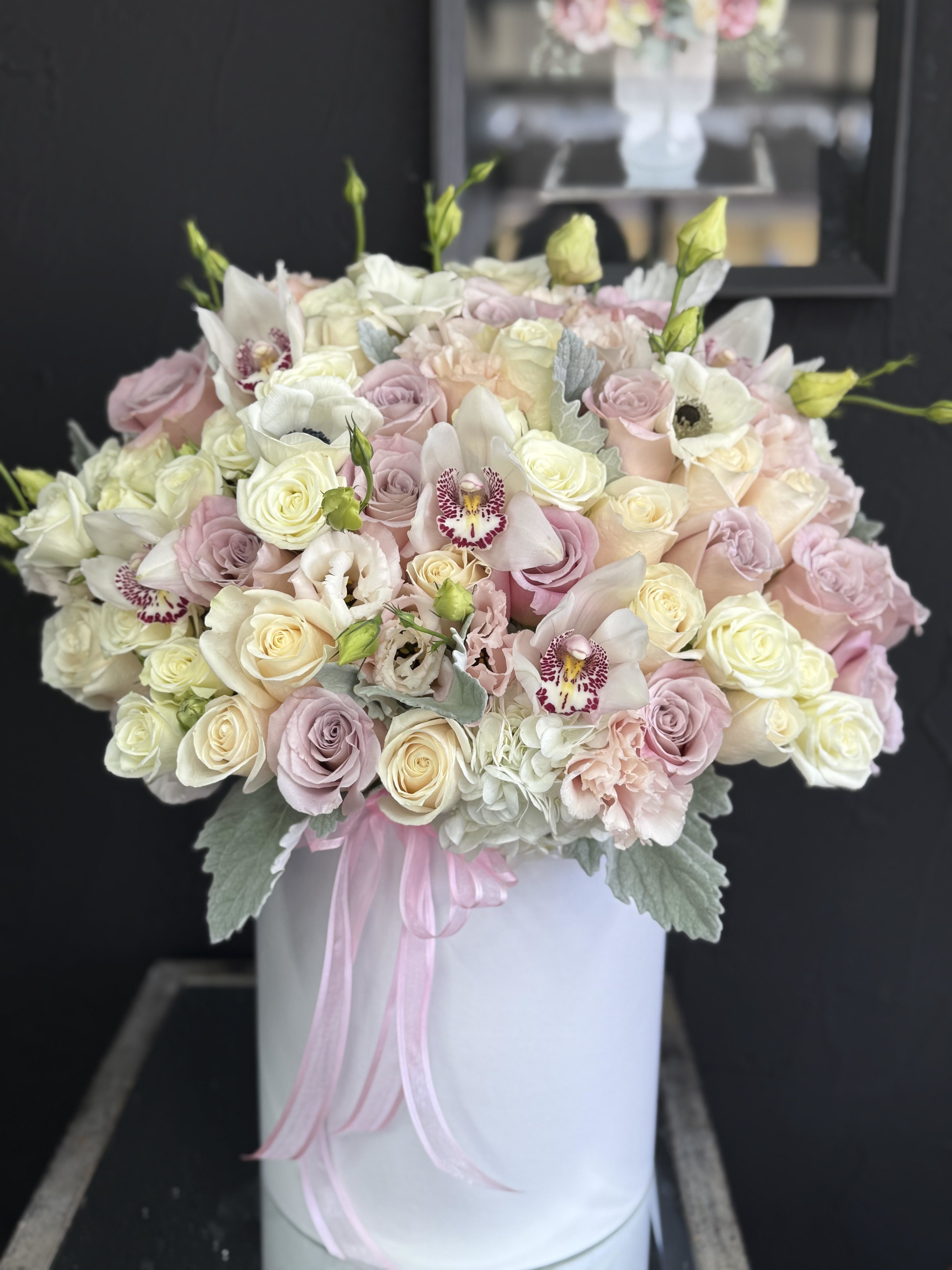 Pure Love Box - An elegant floral arrangement featuring a blend of pure white and vibrant blooms. Perfectly balanced in color and style, it brings freshness, beauty, and a touch of sophistication to any occasion.