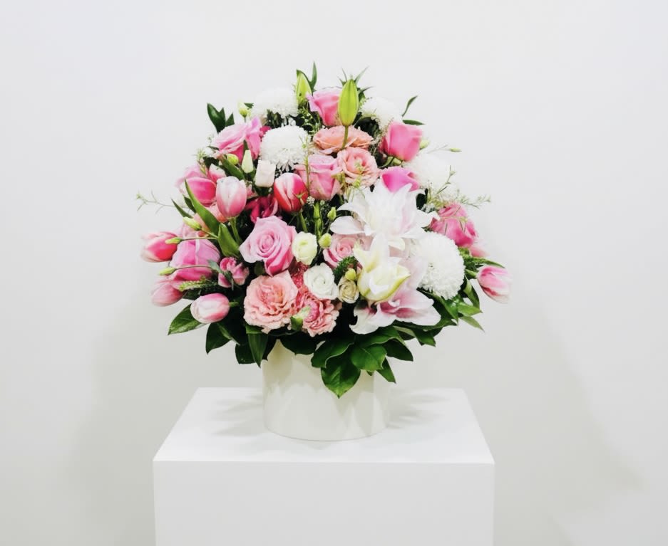 Je t’adore Arrangement ( Pink Roses, lilies and Tulips) - Je t’adore — A delicate symphony of blush roses, soft tulips, and creamy blooms designed to express pure devotion. Elegant, timeless, and deeply romantic — just like the one you adore.   Each piece features the freshest seasonal blooms, selected for beauty and balance. Perfect when you want something unique. 