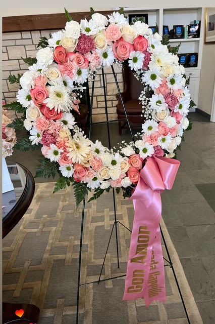 Soft pink and white Sympathy Wreat - A delicate and loving tribute, this crown expresses peace, tenderness, and respect with roses, daisies, and soft carnations.