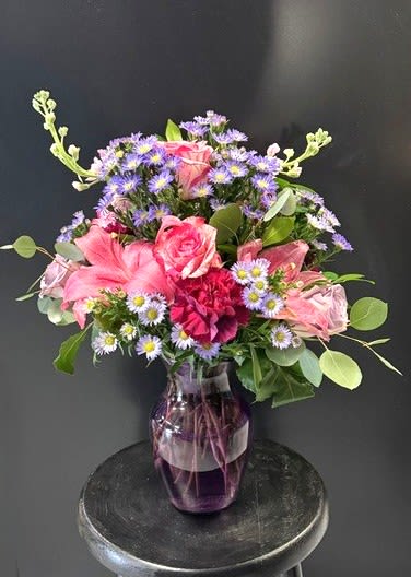 #A023 - Celebration! - Pink and purple asters, carnations, Asiatic lilies and roses arranged in a cheerful vase-perfect for Easter, Mother's Day, birthdays or just because to brighten any table. 