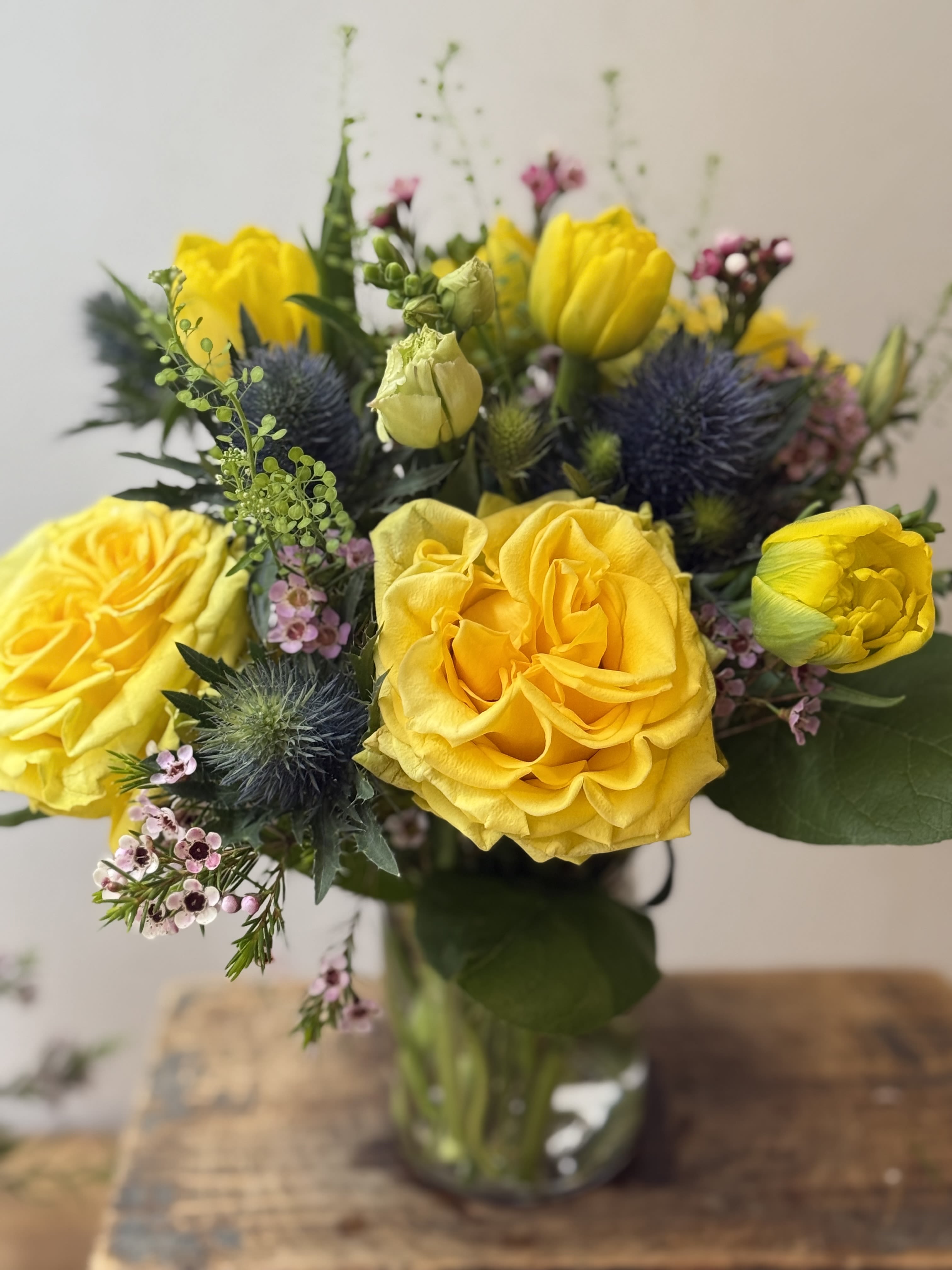 Mellow Yellow - The cutest vase with bright yellow roses and tulips. The perfect pick me up! .