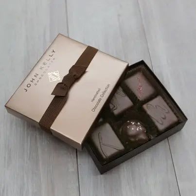SOLD OUT | John Kelly Chocolates | 6 Piece Signature Hand-Crafted Collection - Contains: 1 Dark Chocolate with Walnuts 1 White Chocolate Vanilla with Walnuts 1 Semi-Sweet Chocolate &amp; Caramel with Hawaiian Alaea Sea Salt 1 Dark Chocolate with French Grey Sea Salt 1 Walnut Caramel Cluster with Mediterranean Sea Salt 1 Semi-Sweet Chocolate Raspberry Gluten Free, Kosher Dairy.
