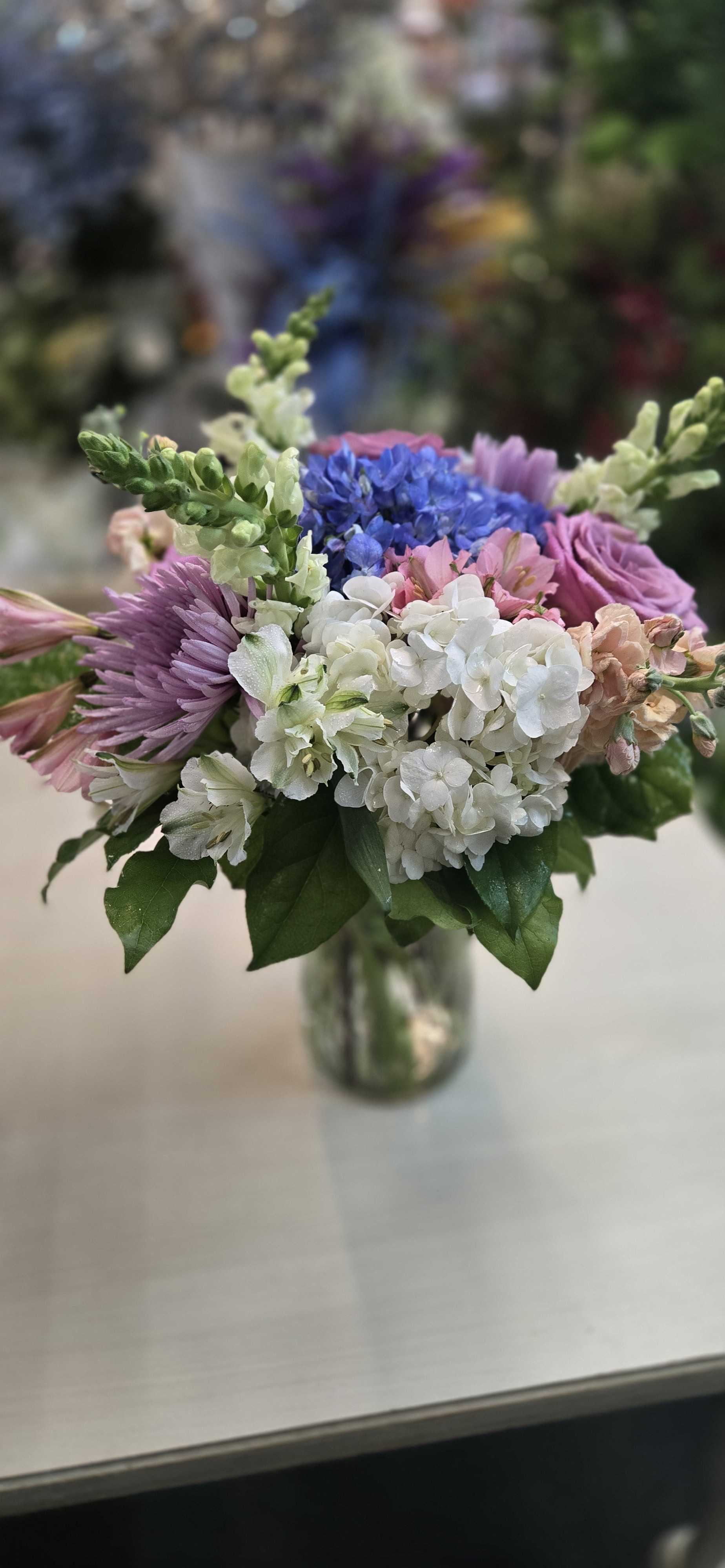 Art &amp; Flowers Exclusive "Diamond Love" - A giant luxury arrangement? Sign us up. Instead of sending standard red roses only, send them something soft and pretty and sweet to say "I care". We will use a seasonally fresh assortment of blooms in soft pastel tones. Vase shapes and sizes will vary depending upon the size design you choose.   The floral content may vary due to seasonal availability.  