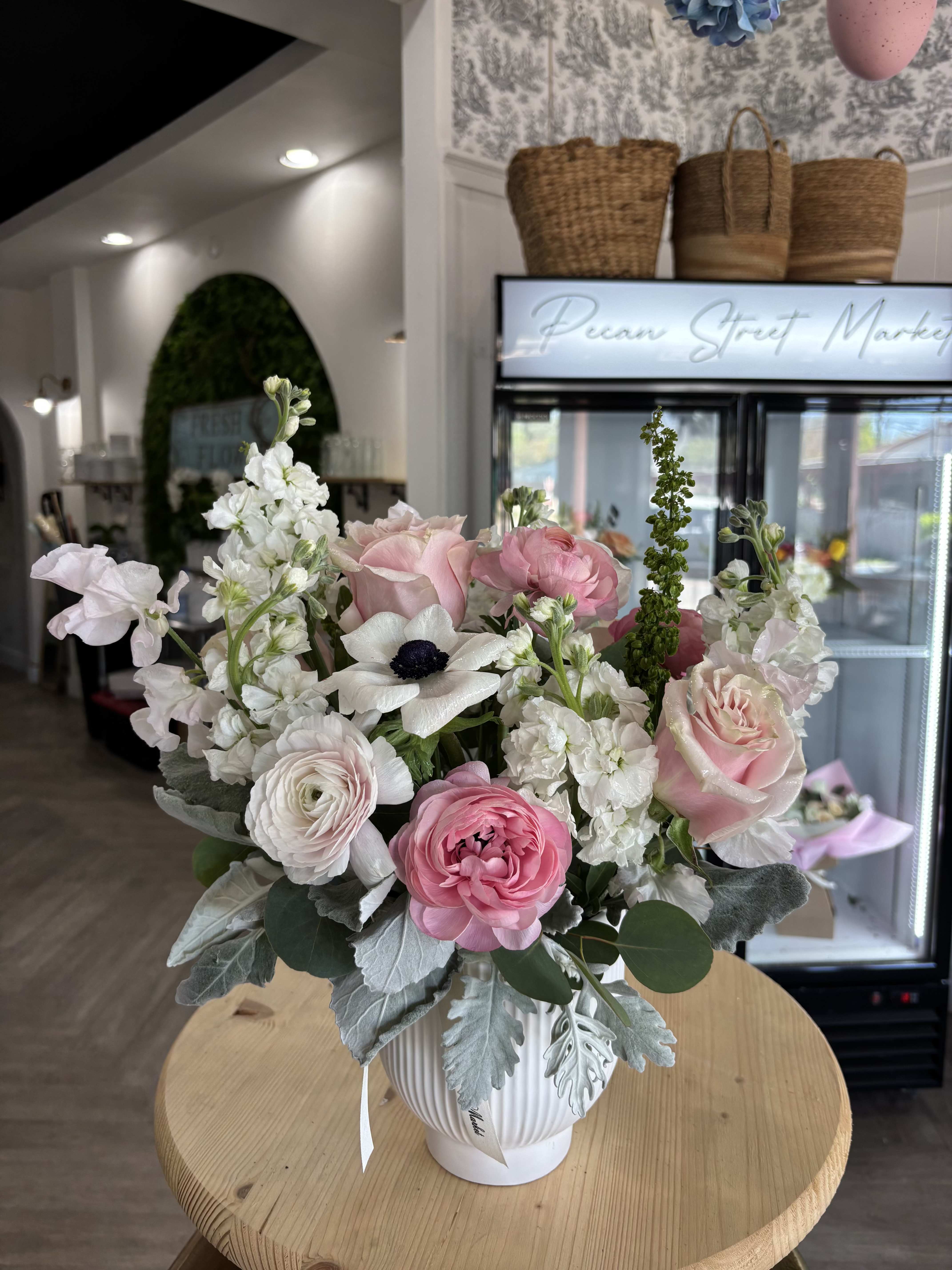 English Garden - Soft, garden-fresh charm greets the recipient with this English Garden flower arrangement-a romantic bouquet-style centerpiece perfect for Valentine's Day, anniversaries, or to celebrate Mother's Day. The mix of pink, white, peach and hints of orange reads like a sunlit cottage garden; the overall impression is light, intimate, and unmistakably thoughtful for the person you're celebrating.