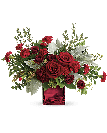 Red roses and carnations in a red glass vase