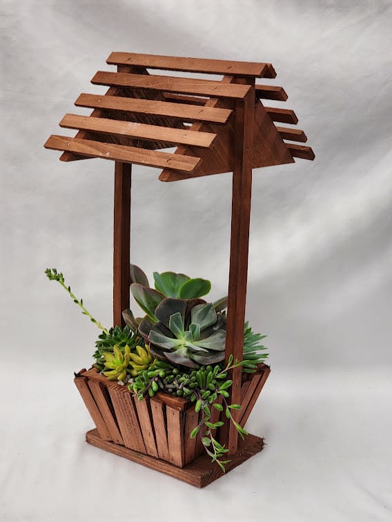 Redwood Well Succulent Planter - This well made of redwood is the perfect gift for any plant lover as it is filled with a variety of beautiful succulents.  Approximately 21H" x 8"L x 8"W