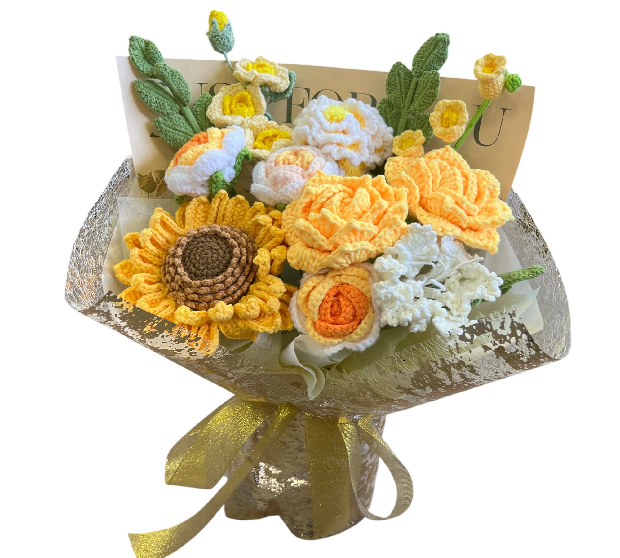 Gold crochet bouquet - A bouquet featuring gold crochet flowers, including sunflowers, roses, and various blossoms with green leaves.