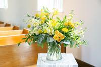 Golden Remembrance – Sympathy Arrangement - Soft, comforting, and filled with gentle light, Golden Remembrance is a sympathy arrangement designed to express warmth, support, and heartfelt remembrance.  This garden-inspired design features a graceful blend of yellow roses, ranunculus, spray roses, and seasonal blooms accented with fresh greenery and delicate textural flowers. The cheerful yellow tones symbolize friendship, gratitude, and the enduring brightness of cherished memories.  Designed in a clear glass vase with natural, airy movement, the arrangement offers a comforting presence in the home during a time of remembrance.  Each piece is thoughtfully handcrafted by the designers at ImpeKable Flowers in DeLand, using carefully selected seasonal flowers sourced from premium growers.  A meaningful choice for expressing sympathy, honoring a life well lived, or sending comfort to family and loved ones.  Flower varieties may vary depending on seasonal availability while maintaining the same color palette and overall design style.