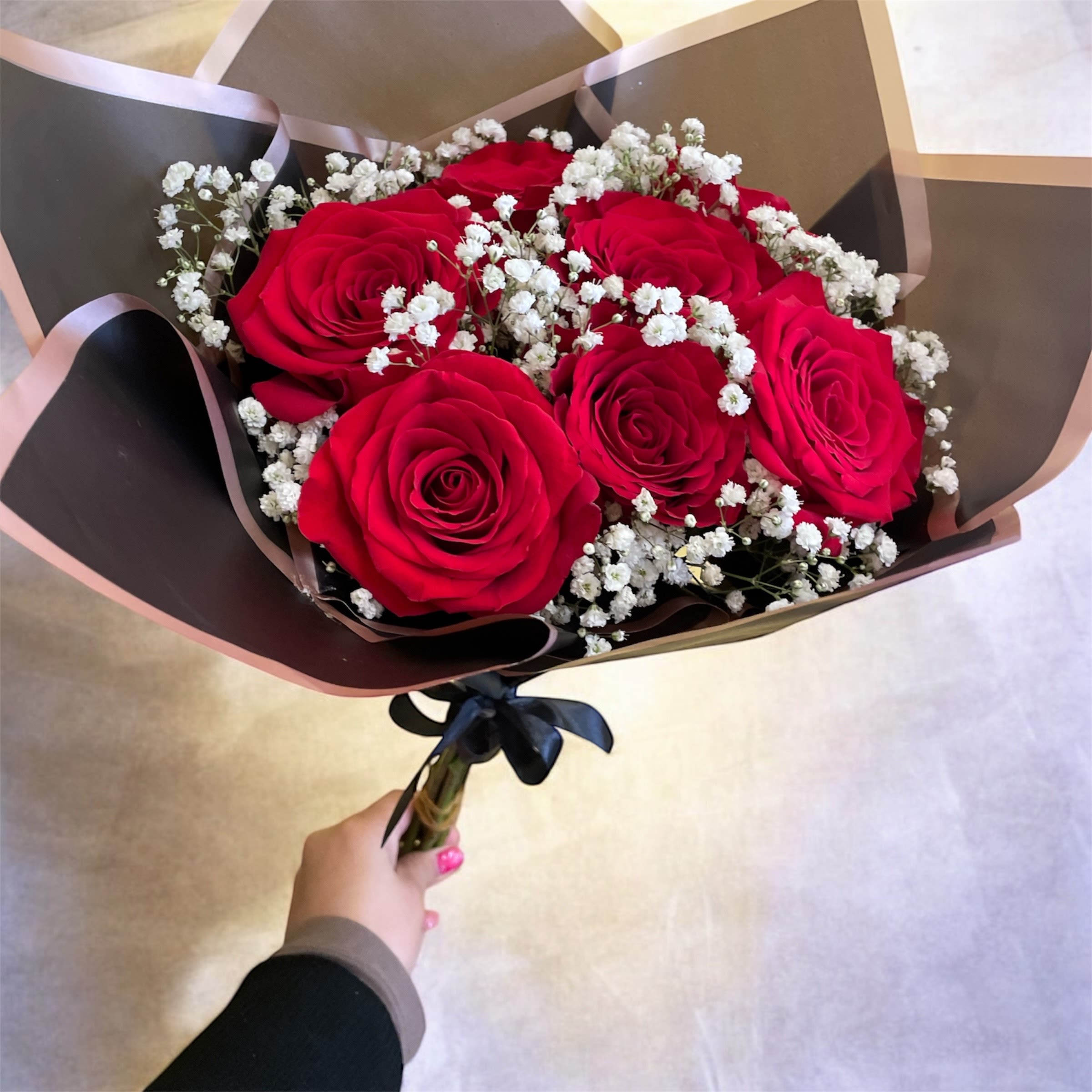 Elegant Red wrapped in black - Beautiful Red Roses wrapped in black Korean paper and tied with a ribbon