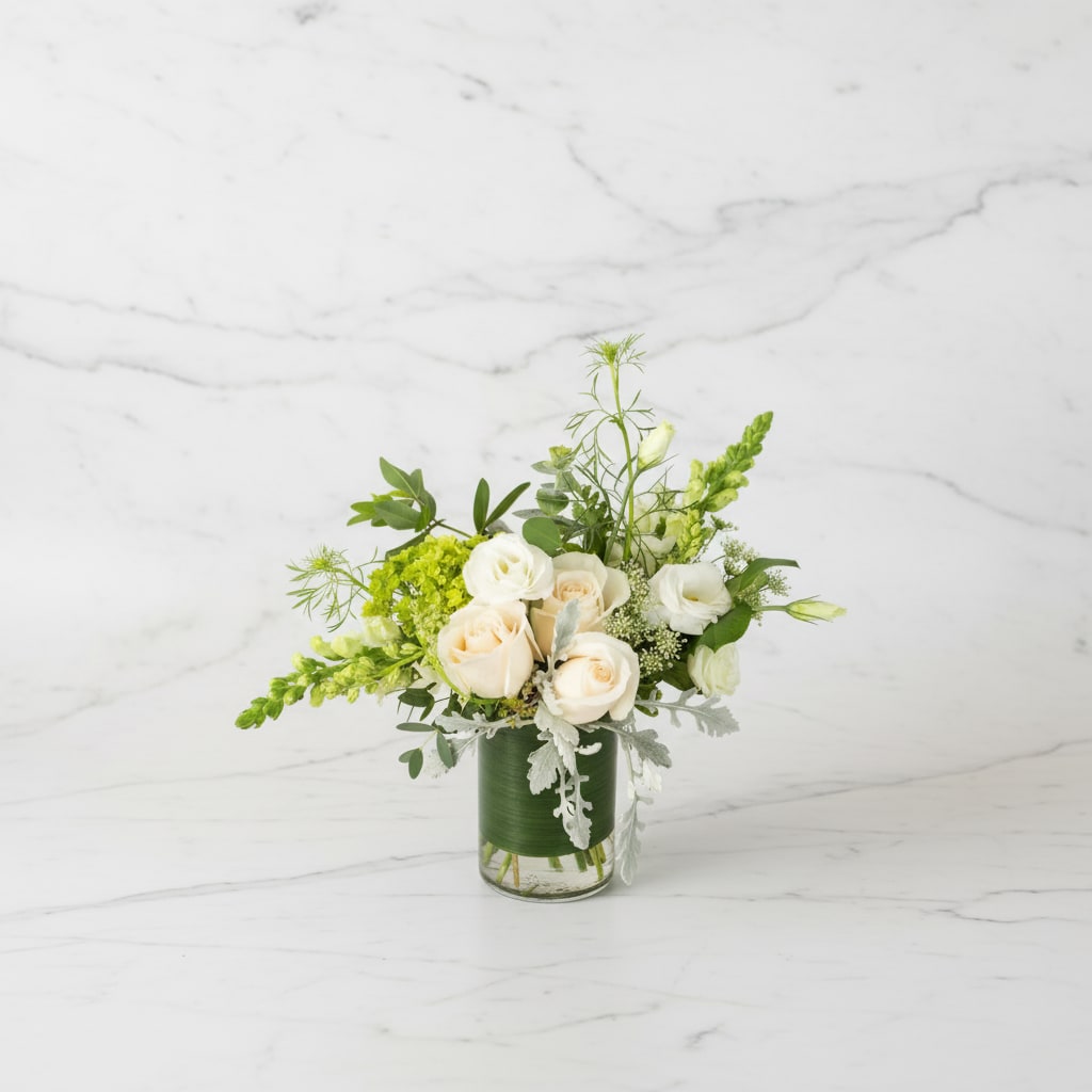 Linen and Lace  - Whites and greens will always be chic  - and this collection features some of our favorite flowers. The crisp colors of Linen and Lace are welcome for any occasion. This is a sophisticated congratulatory gesture or elegant expression of sympathy for the residence.  Approx. 11x9-standard or 10x14-deluxe