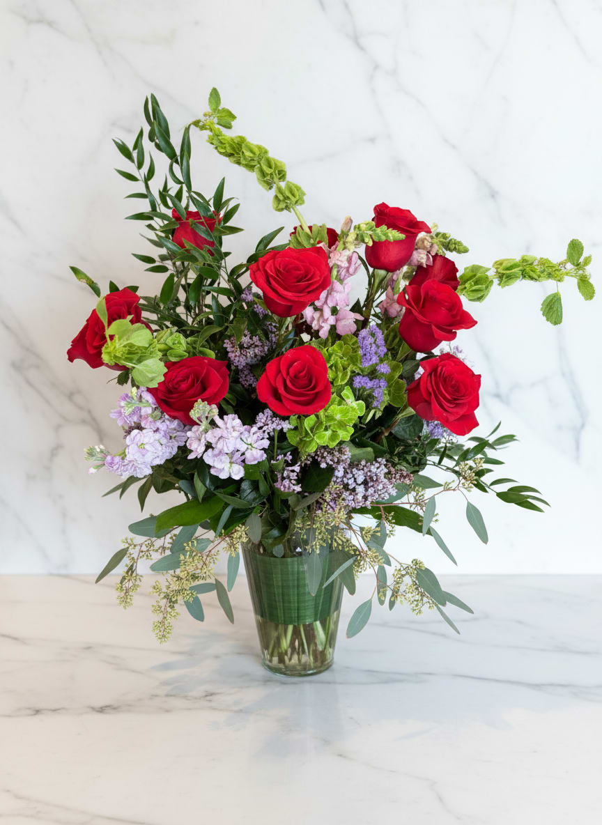 The Gardener's Dozen  - A fresh take on the classic dozen - luxurious red roses designed in a loose, garden style with season blooms such as hydrangea, elegant snap dragon and fragrant eucalyptus.  A romantic gesture for Mother's Day or any day that needs to feel just a bit more luxe. 