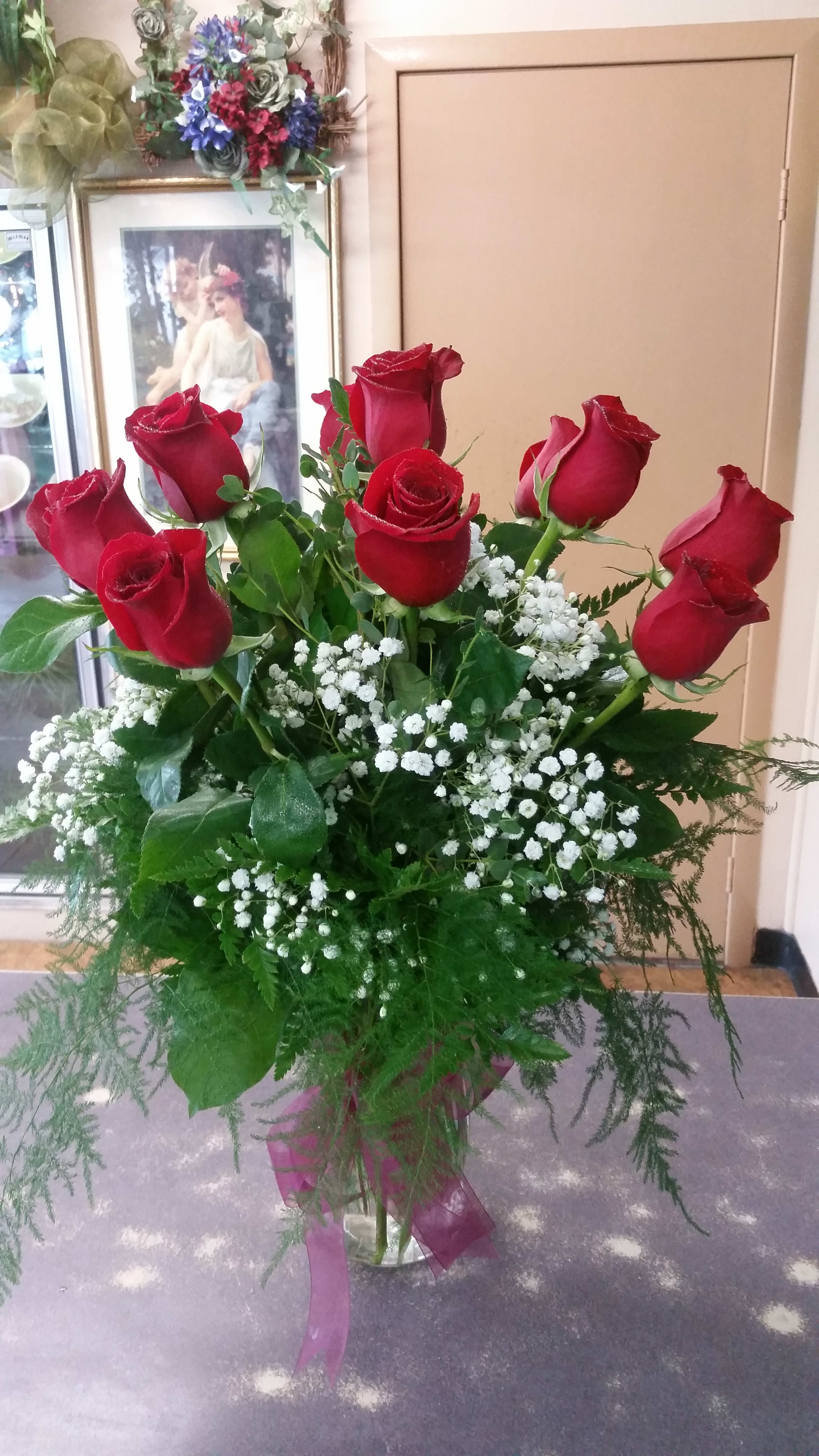 My One True Love  - 12 long stem red roses arranged in a tall glass vase with assorted greens and baby's breath. 