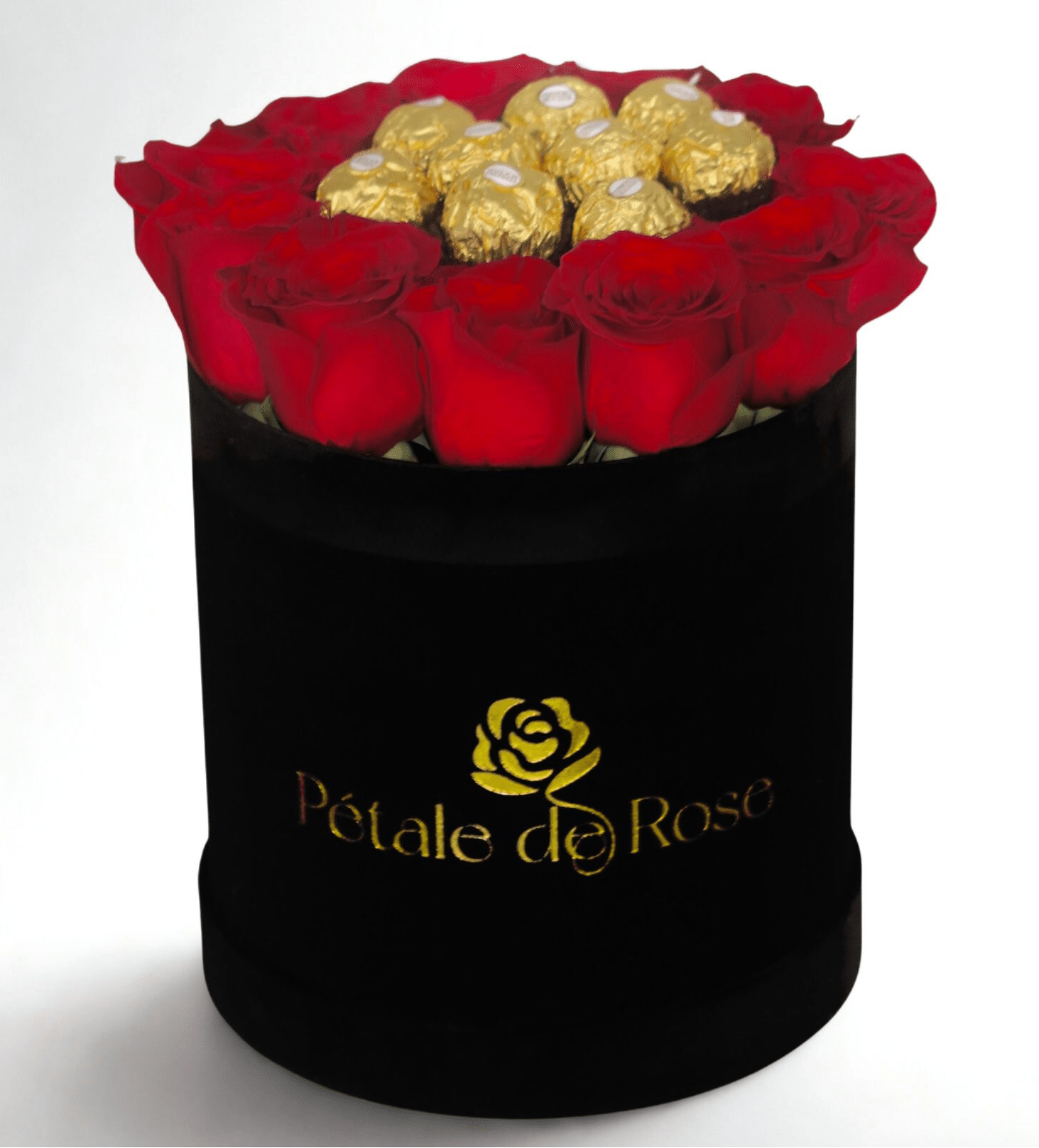 Round black hatbox with red roses surrounding gold-wrapped chocolates on top