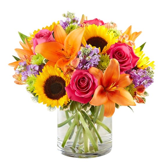 Sunshine Garden - A vibrant and energetic arrangement featuring bold sunflowers, elegant orange lilies, romantic pink roses, and fresh seasonal fillers. Designed to express joy, warmth, and positivity, this bouquet is perfect for birthdays, celebrations, or simply brightening someone's day. Note: Due to seasonal and market availability, certain flowers or colors may be substituted with others of equal or greater value while maintaining the overall style and quality.