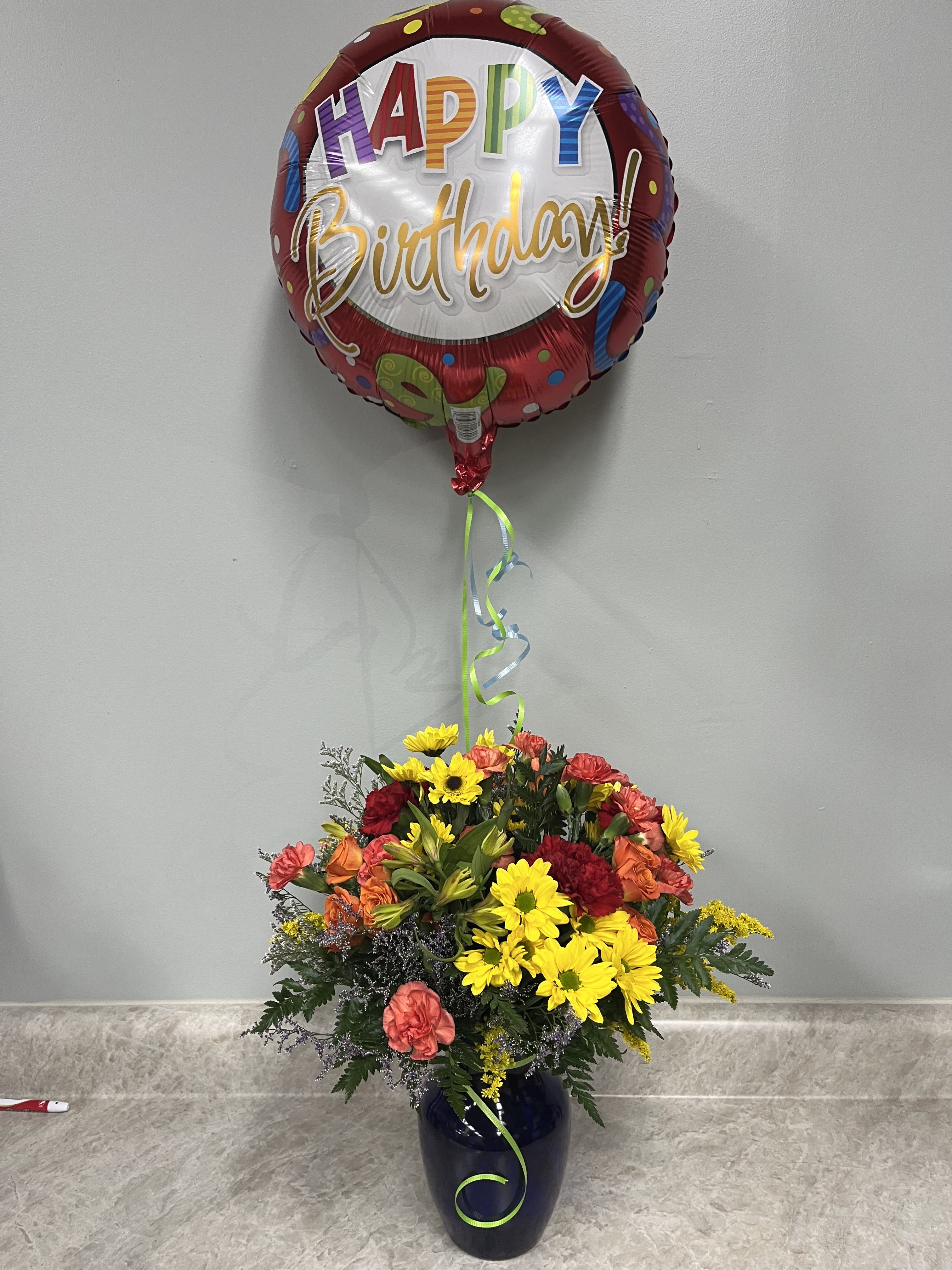 It's Your Birthday Bouquet - Blue vase with rainbow of colors of fresh flowers and a mylar balloon.  All around bouquet Approximately 16 3/4" W x 19 1/4" H 