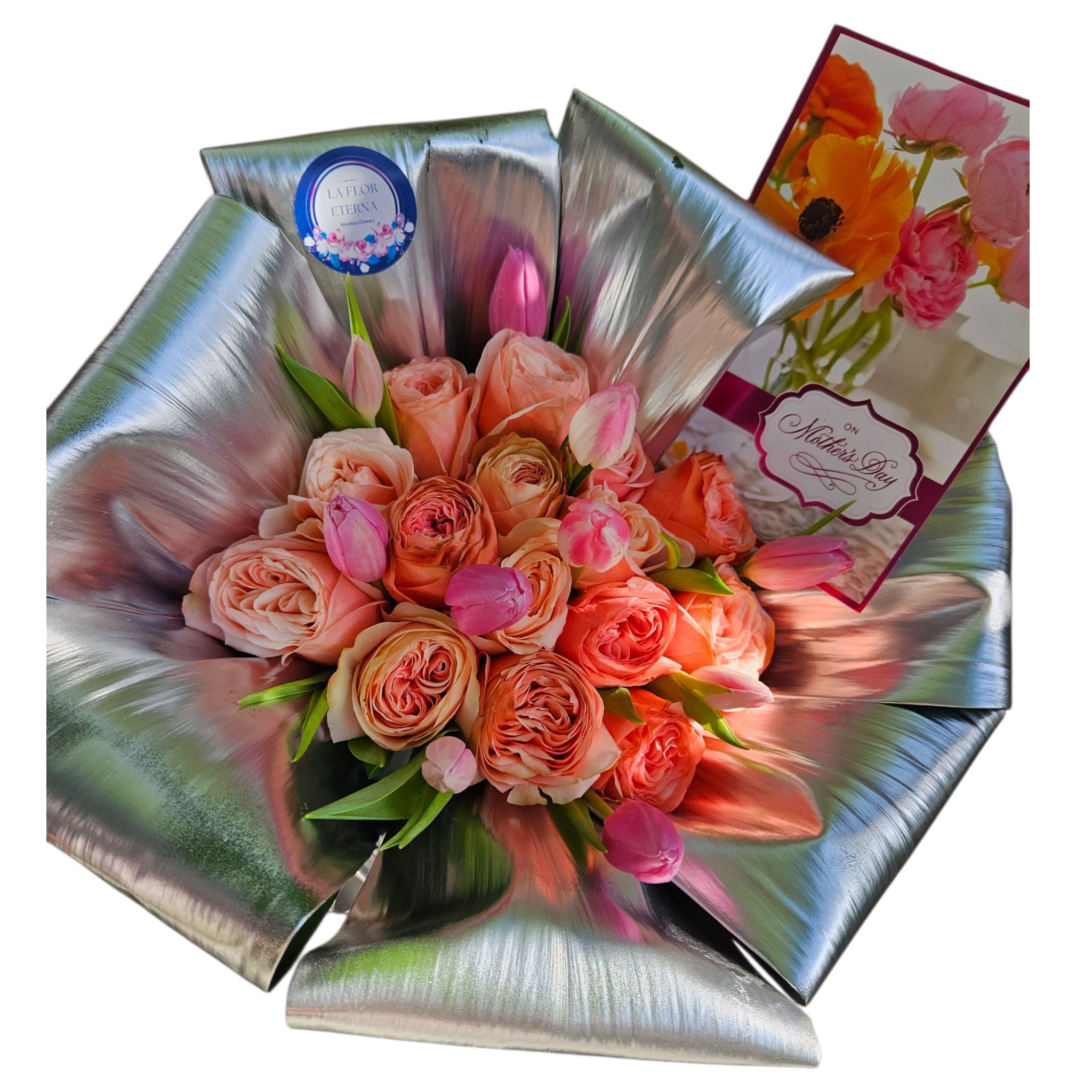 Mother  - A lush cluster of peach roses with soft pink tulips creates a rounded, full bouquet that reads both feminine and celebratory - ideal as a Mother's Day bouquet or a thoughtful arrangement for anniversaries and thank-you gifts. The warm peach and pink palette makes the recipient feel cherished and seen, while the dramatic metallic silver wrapping  green plant  gives the whole gift a modern, polished presentation.  This arrangement features tightly grouped peach roses accented by petite pink tulips, assembled into a compact, dome-shaped bouquet. The blooms are wrapped in reflective metallic silver  that fans outward to frame the flowers and catch the light, and a colorful greeting card with floral artwork and a Mother's Day message is tucked into the bouquet for a personal touch. The combination of soft petals and sleek silver makes this a memorable, photo-ready gift that balances classic florals with contemporary style.  Perfect for the mom, grandmother, or special woman you're celebrating, this bouquet communicates warmth, appreciation, and a little glamour all at once. Order with standard sizing to ensure the rounded, hand-tied look is preserved; the greeting card is not included. Included  to make it gift-ready on arrival.