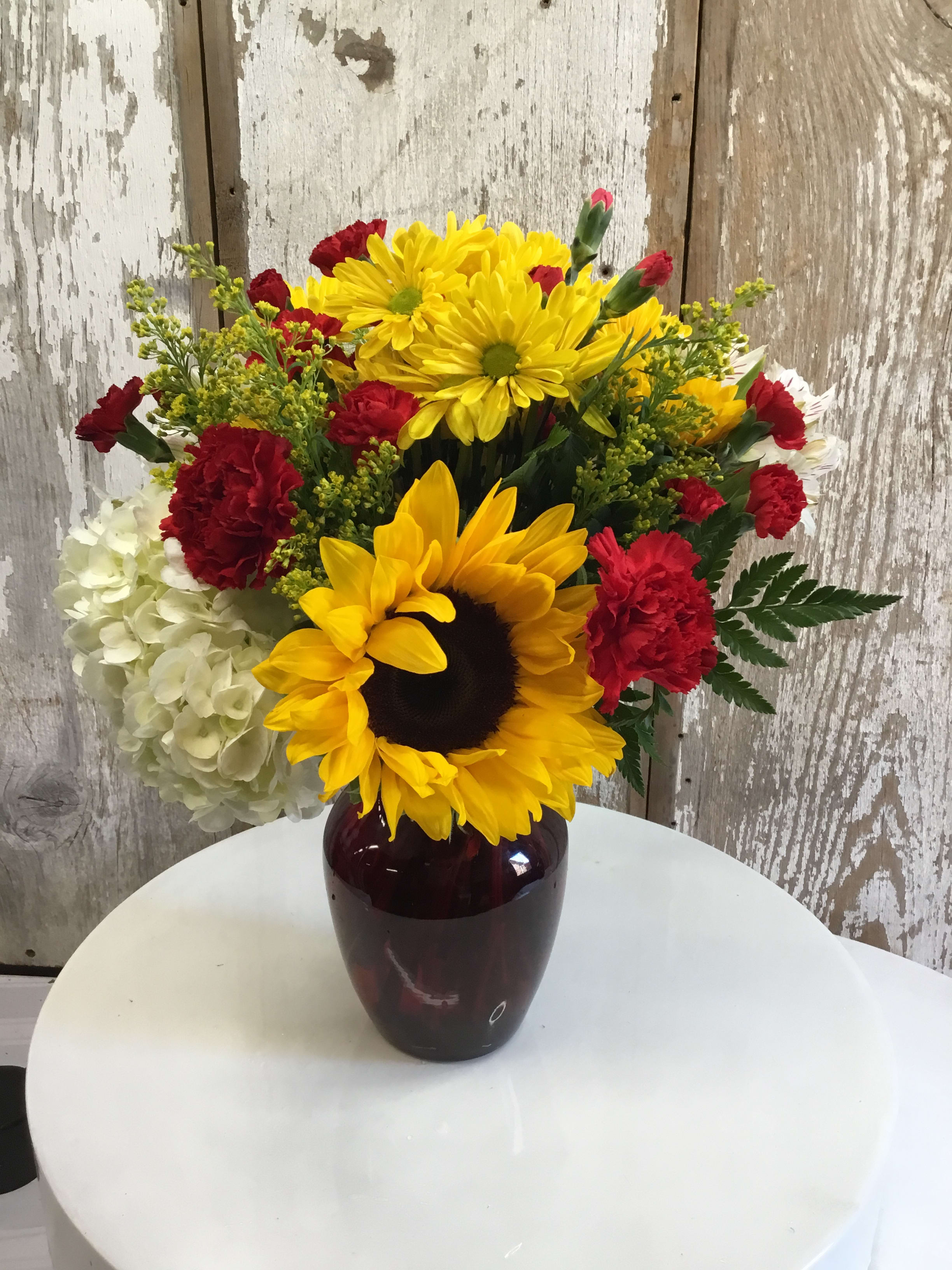 Red Friday - Sunflowers, Daisies or Mums, Hydrangeas, Carnations and Solidago in Red Vase