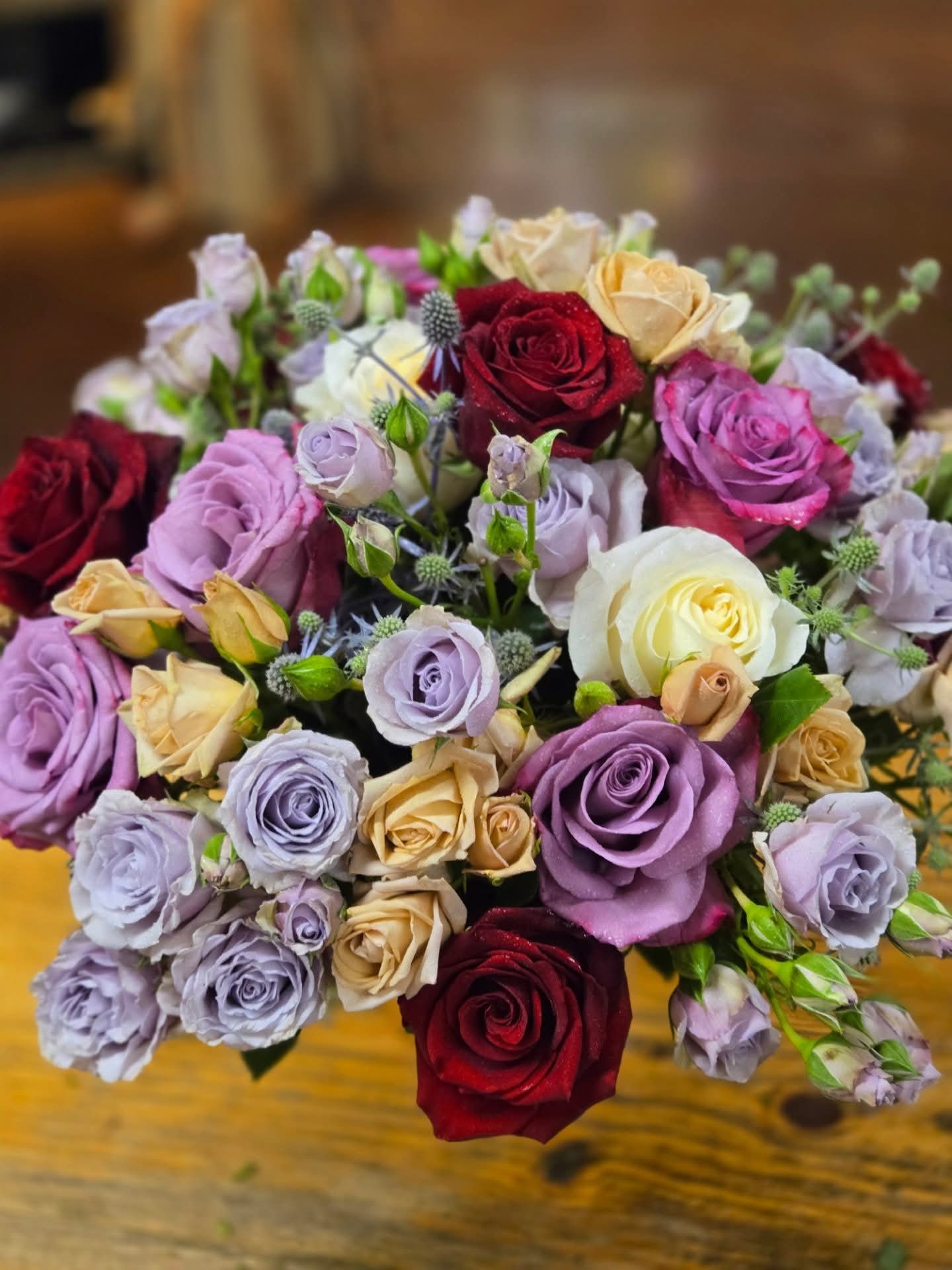 Romance - This lovely display of full size and spray roses is stunning and will surely make a lasting impression! Colors will match the photo unless you specify other colors in the request section. 