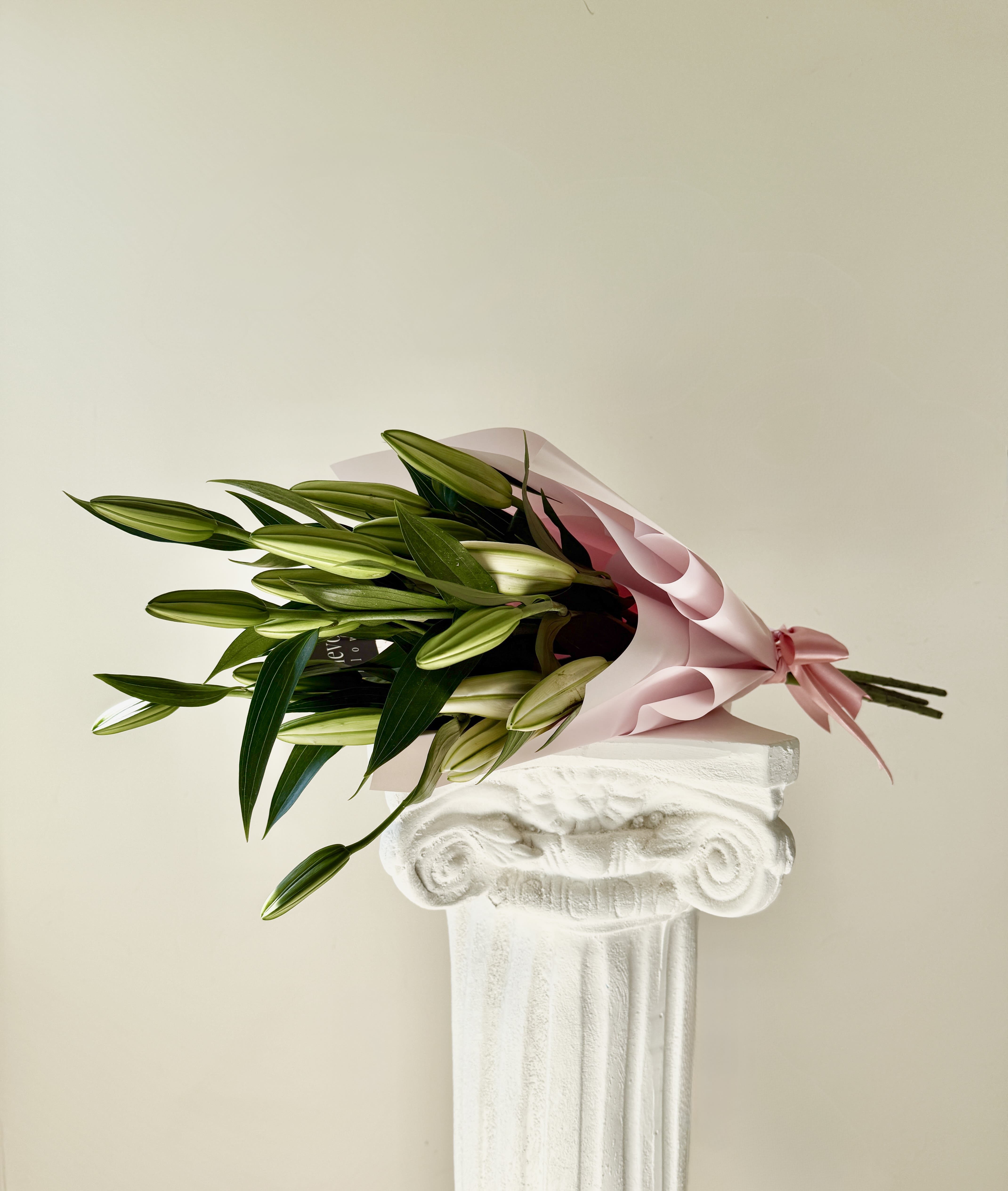 Premium Lily Bouquet - A stunning arrangement of majestic, fragrant oriental lilies, elegantly wrapped in delicate pink paper to enhance their natural beauty.  Delivered with blooms closed or partially open, allowing you to enjoy their gradual blossoming and extend their freshness for as long as possible.  Each stem is carefully selected to ensure elegance, fragrance, and an impeccable presentation the signature of Flevoland Flowers.