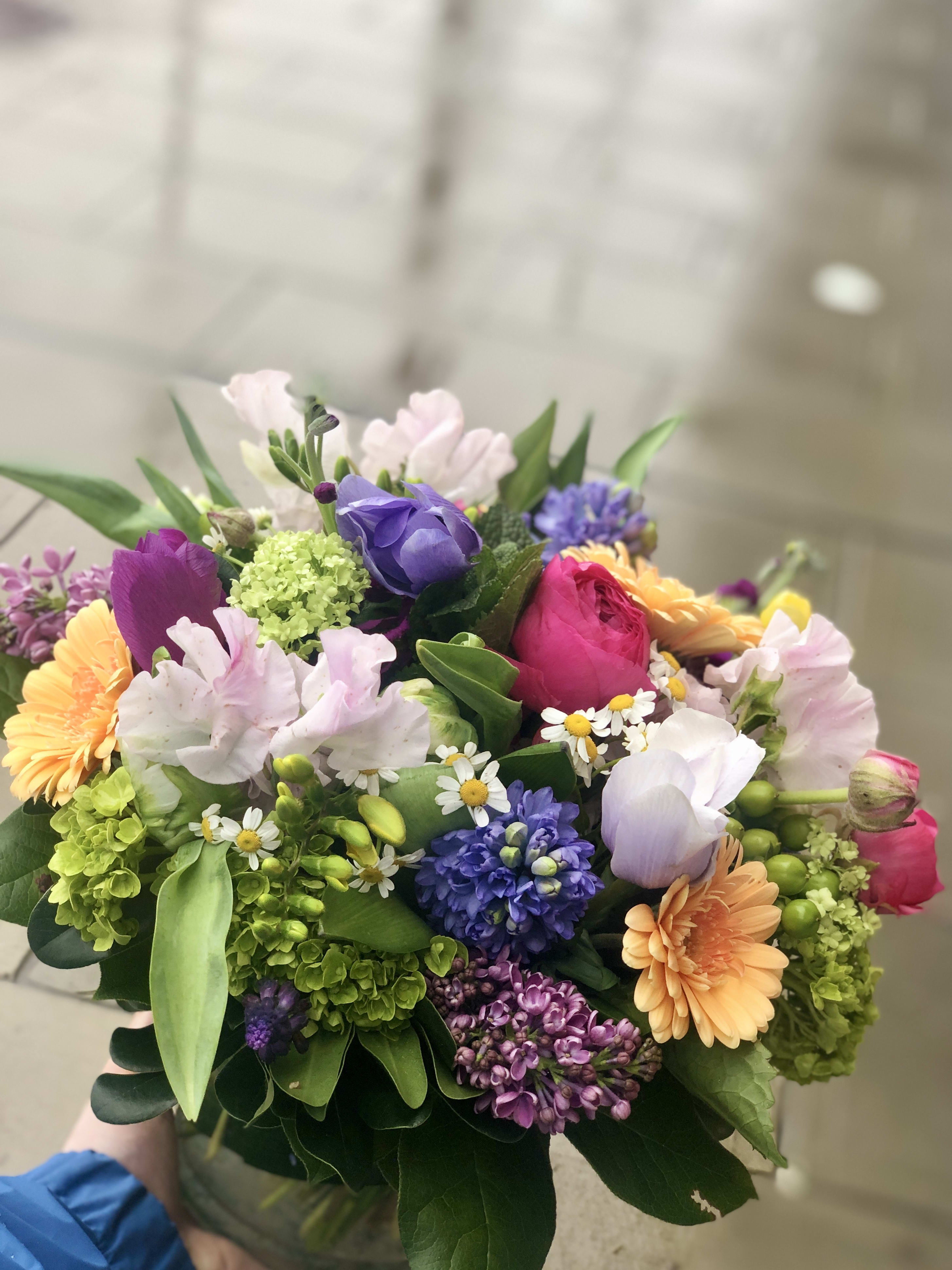 Bright Spring Vase (Spring Designer's Choice) - A cheerful mix of seasonal spring flowers in mixed colors. Great for any occasion! Vase typically includes a changing variety of spring flowers including tulips, hydrangea, hyacinth, daffodils and any special ingredients we may have that day. Please let us know if you have specific requests or questions!