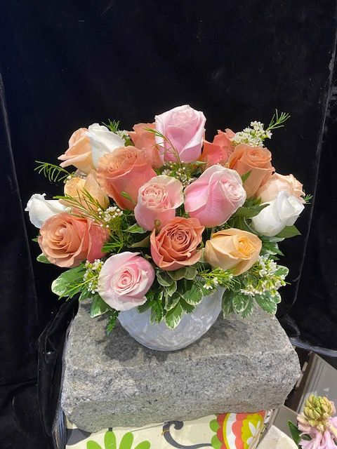 Sweet Peaches and Apricots   - Three lovely colors of roses in light tones join together to bring a touch of sunshine to anyone you choose.  Peach, pale buttercream, white or terra cotta (we choose) are so pretty together.  A full dozen roses in a large cream bisque pot.  Lovely!