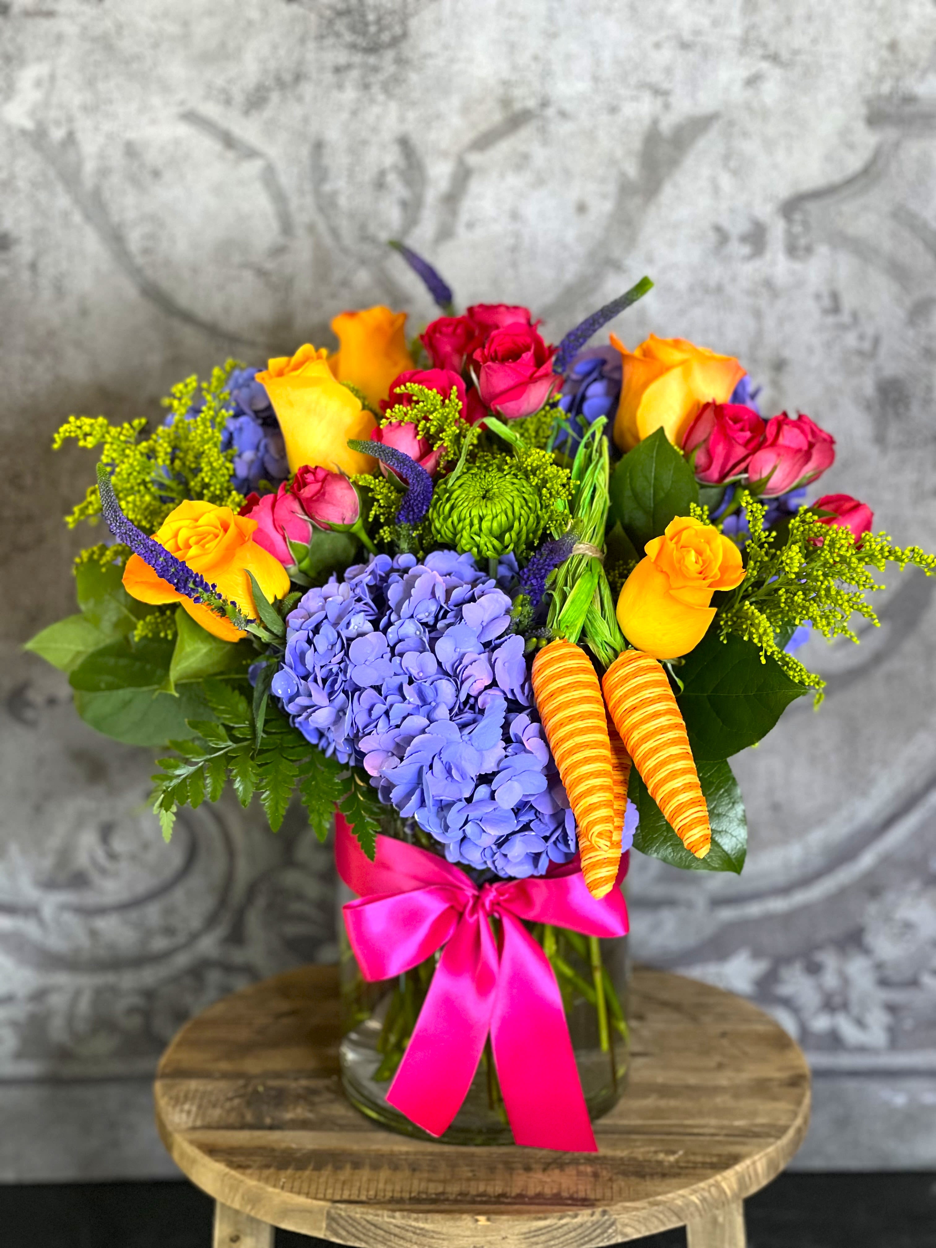 Spring Harvest Bouquet - This adorable arrangement of bright spring flowers is sure to put a smile on your face. 